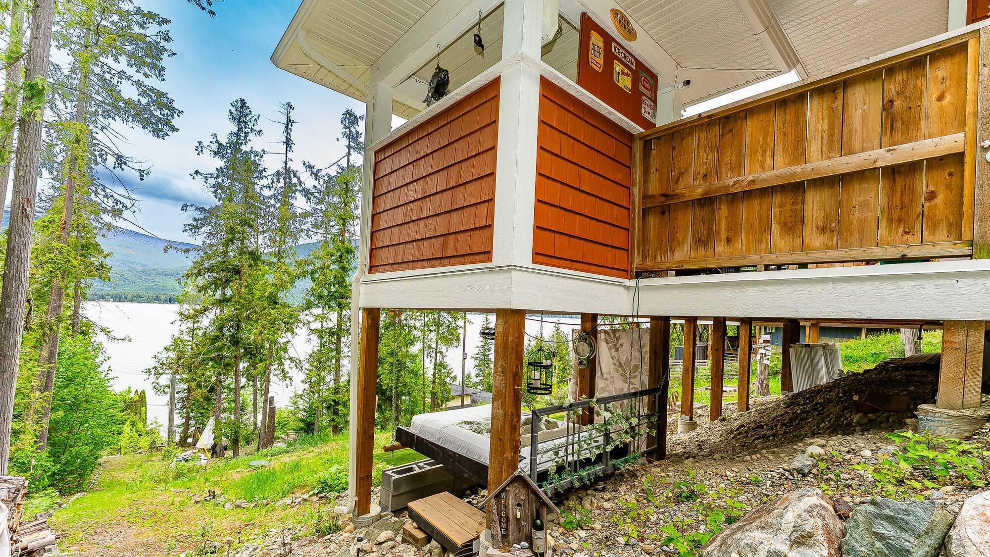 Built in 2022 and covered by a new home warranty, this custom 3 bedroom, 3 bathroom cottage blends modern comfort with relaxed lake living with potential for 4 season living! 3