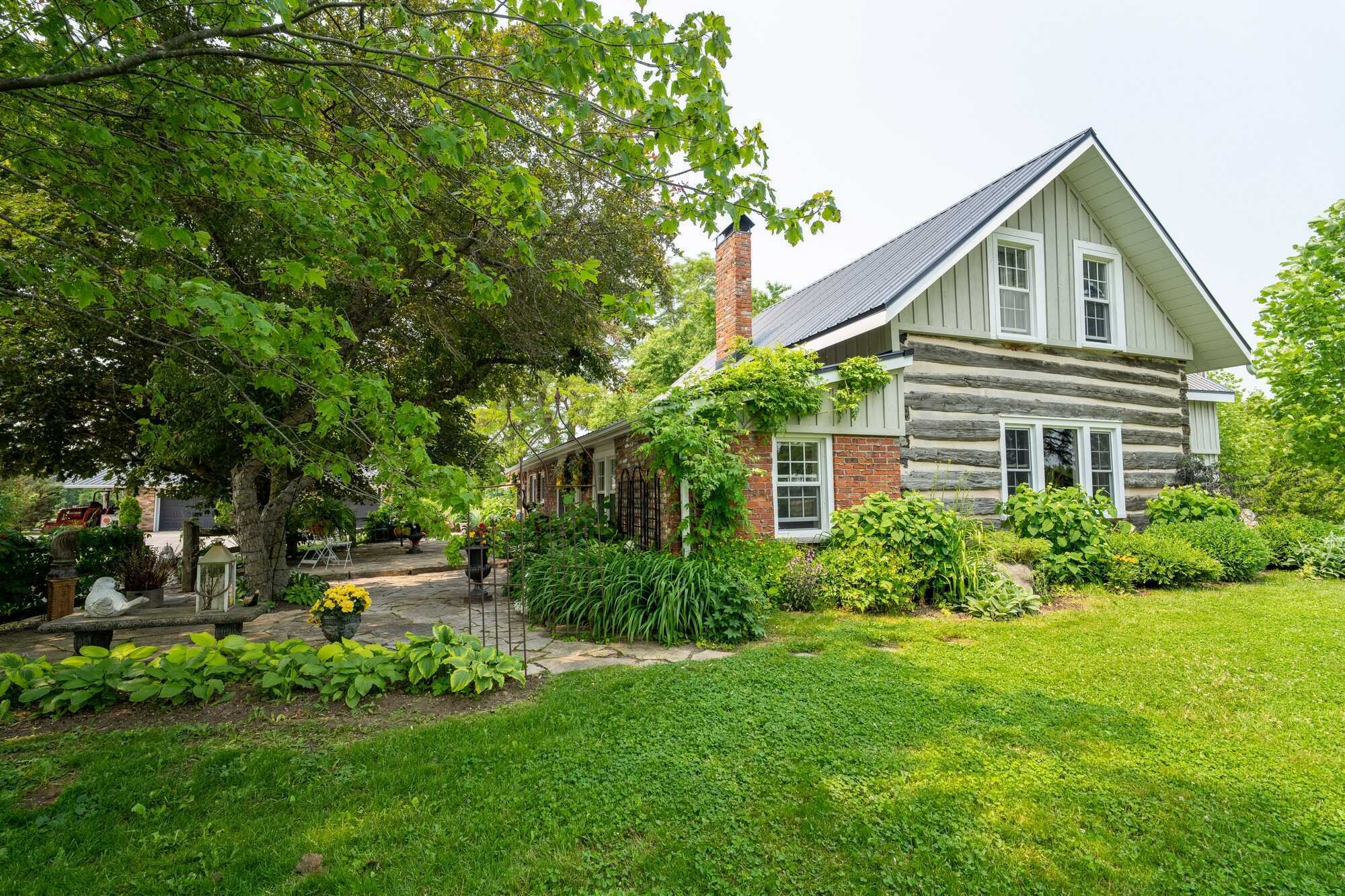 Amazing 70 acre property featuring an Equine Centre, fully renovated 5 bedroom Century Home, 3 car detached garage and a 15 stall horse barn! 2