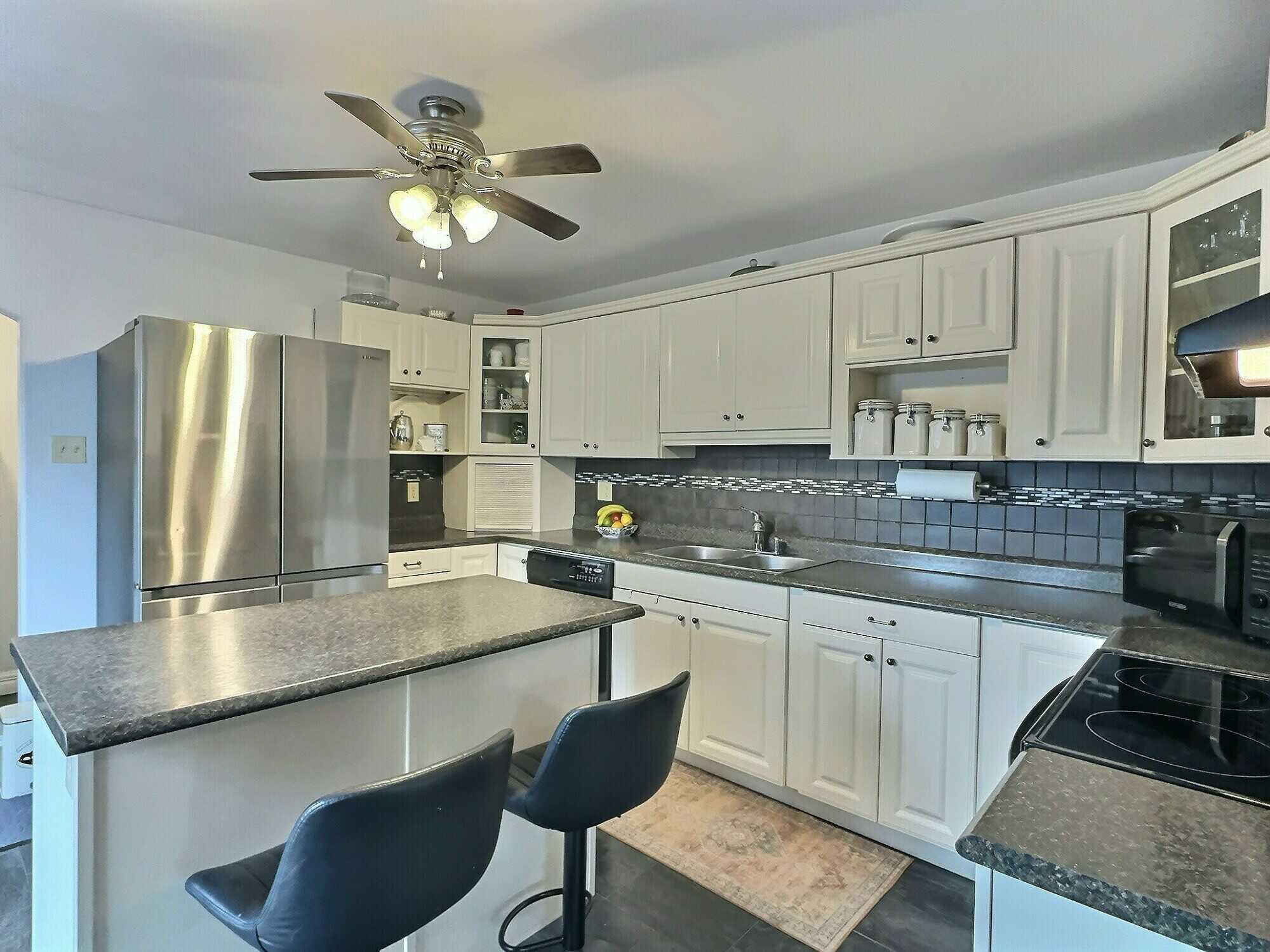 Beautifully updated and modernized property offering flexibility for multi-generational living, rental income, or a spacious single-family home. 5
