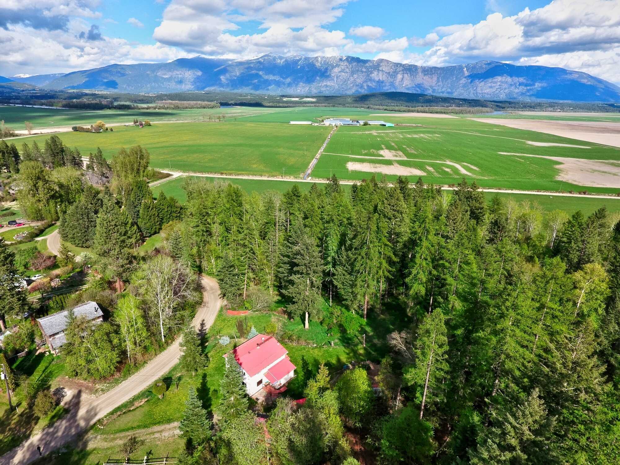 Rural Creston property!  Charming Country Home 2/3 Bed 2 Bath! Carport & Small Shop! Nearly ½ Acre Lot!  PRIVATE & Backs onto Crown Land! 5