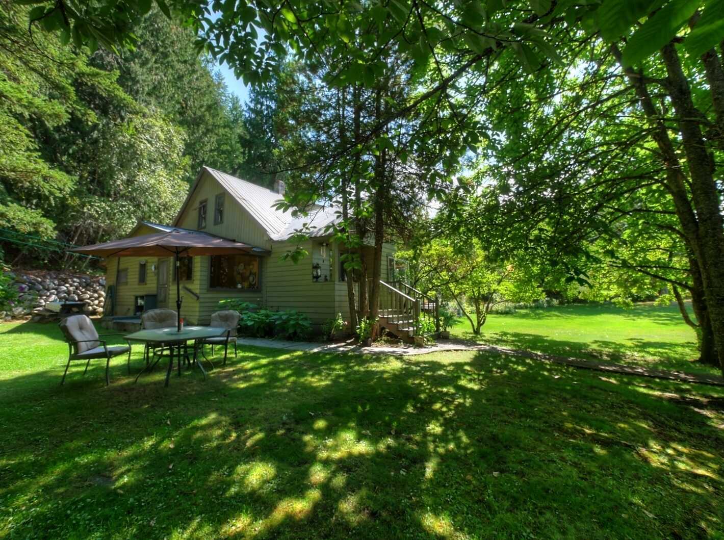 MOTIVATED SELLERS!!!  READY TO DOWNSIZE!!!  Own the whole block!! Private 1/4 acre lot with Valhalla Mountain views throughout!! 2 Bay detached carport with workshop with ample storage and detached greenhouse. 2