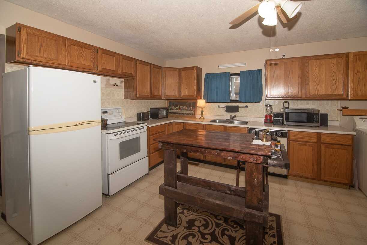 Awsome 2 bedroom RANCHER home on a large corner lot! Very nicely maintained on a fully fenced property with screened in porch, and a powered 10x10 shop/shed 4