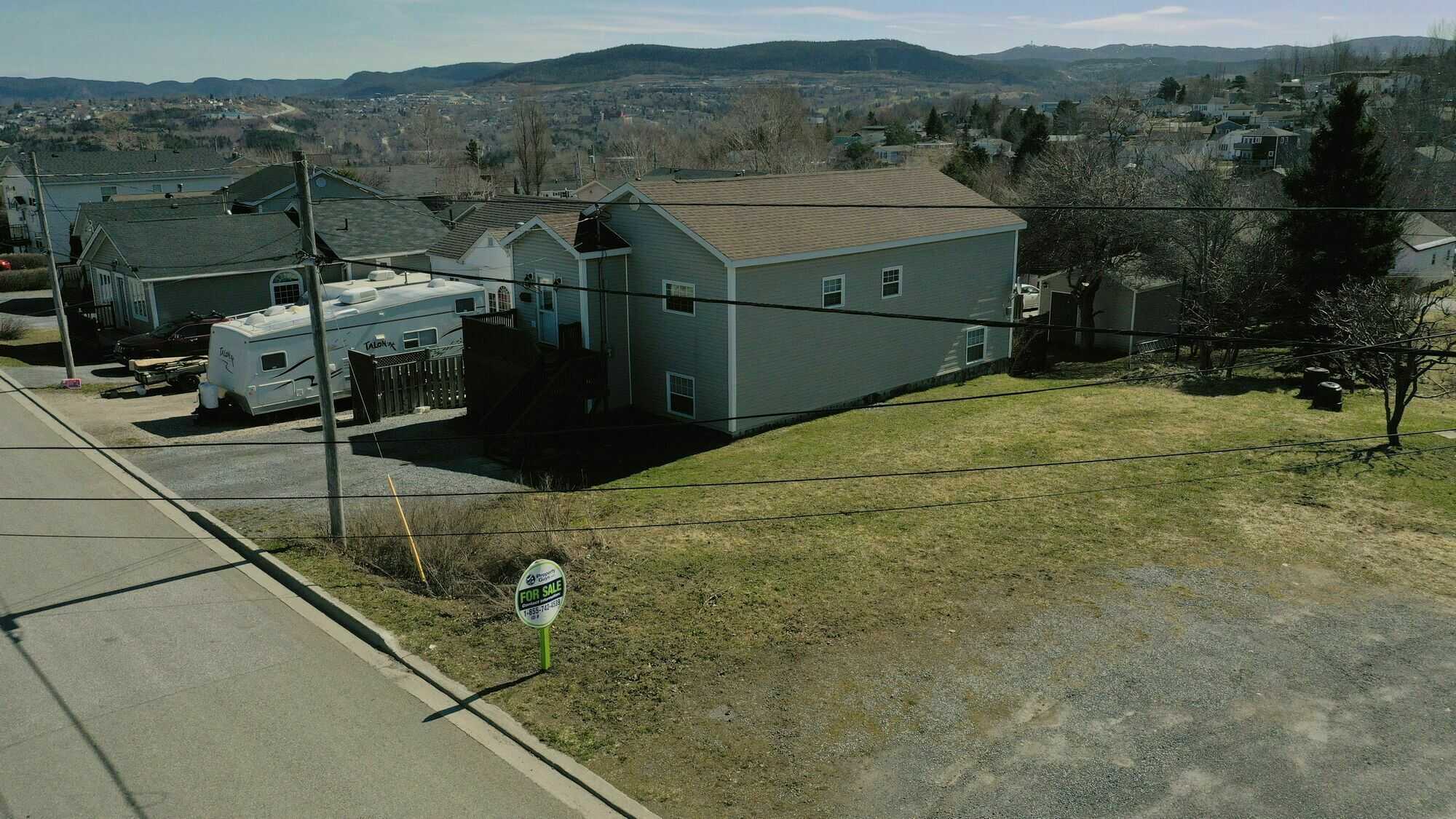 For sale: Prime vacant land, measuring 50 feet by 100 feet, offering a blank canvas for your dream project 3