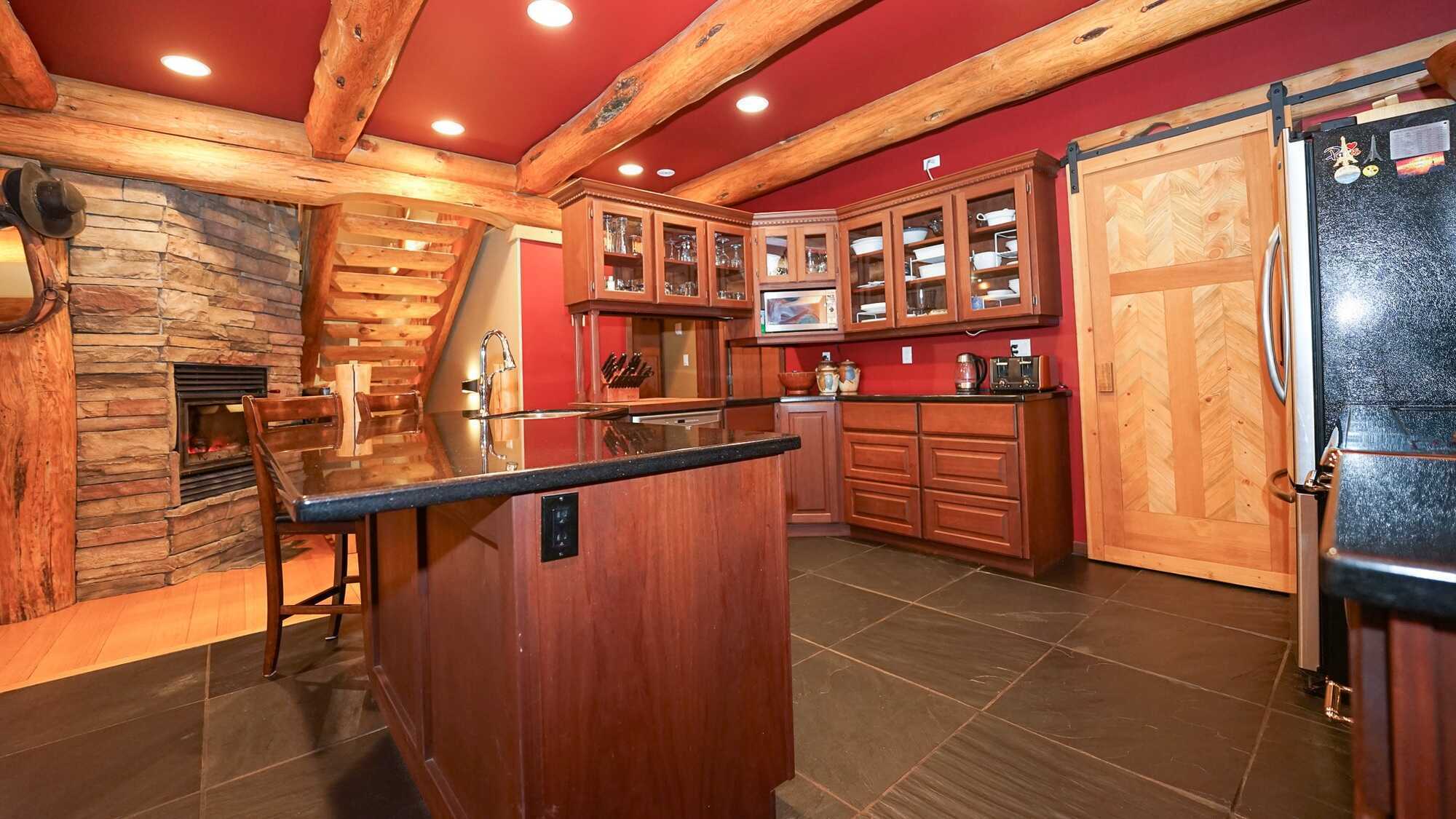 A breathtaking lakefront log cabin on Adams Lake. Custom built and thoughtfully designed, this exceptional home sits on 0.53 acres and offers 3,190 sq ft of beautifully crafted living space, blending rustic character with refined comfort. 5