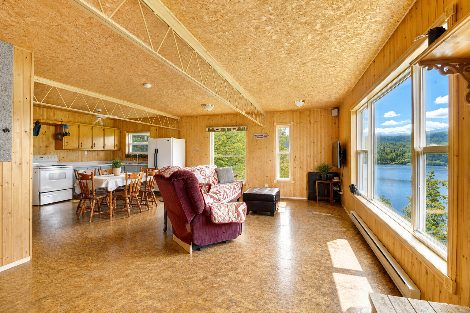 Waterfront living at its finest! This incredible 6 bedroom retreat on 1.25 private acres features two kitchens, two living rooms, a private beach with dock, and endless opportunities for year-round adventure. 5