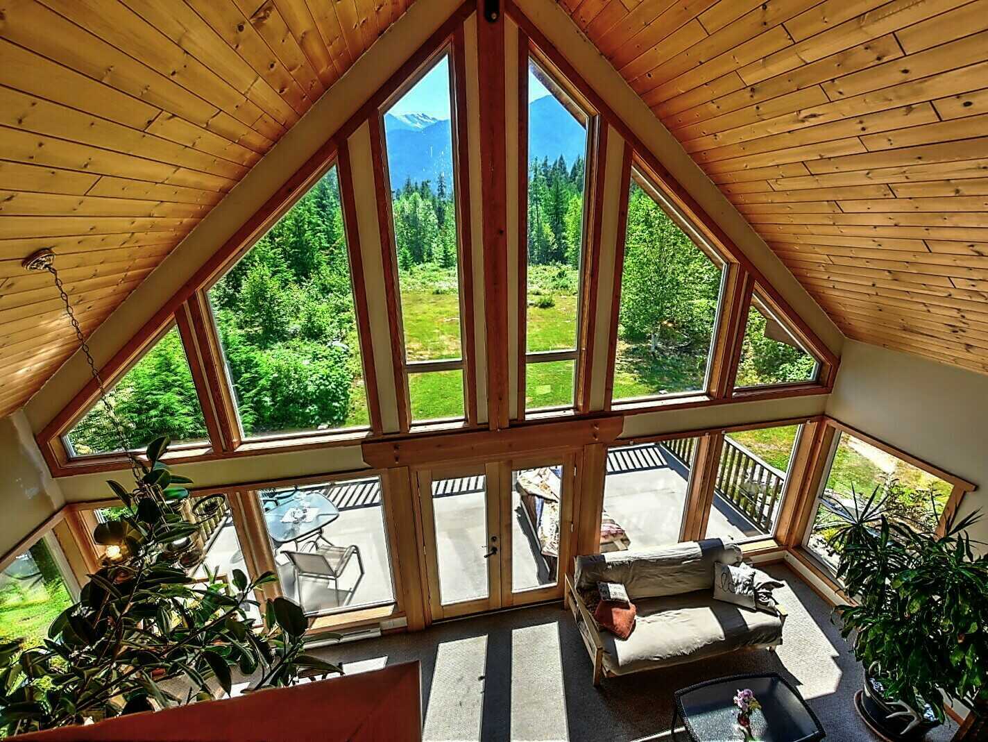 APPROX 28 ACRES! Stunning location! GORGEOUS 4Bed 2Bath Home! 2 min drive to Slocan Lake! Studio building! Potential Farm! 4