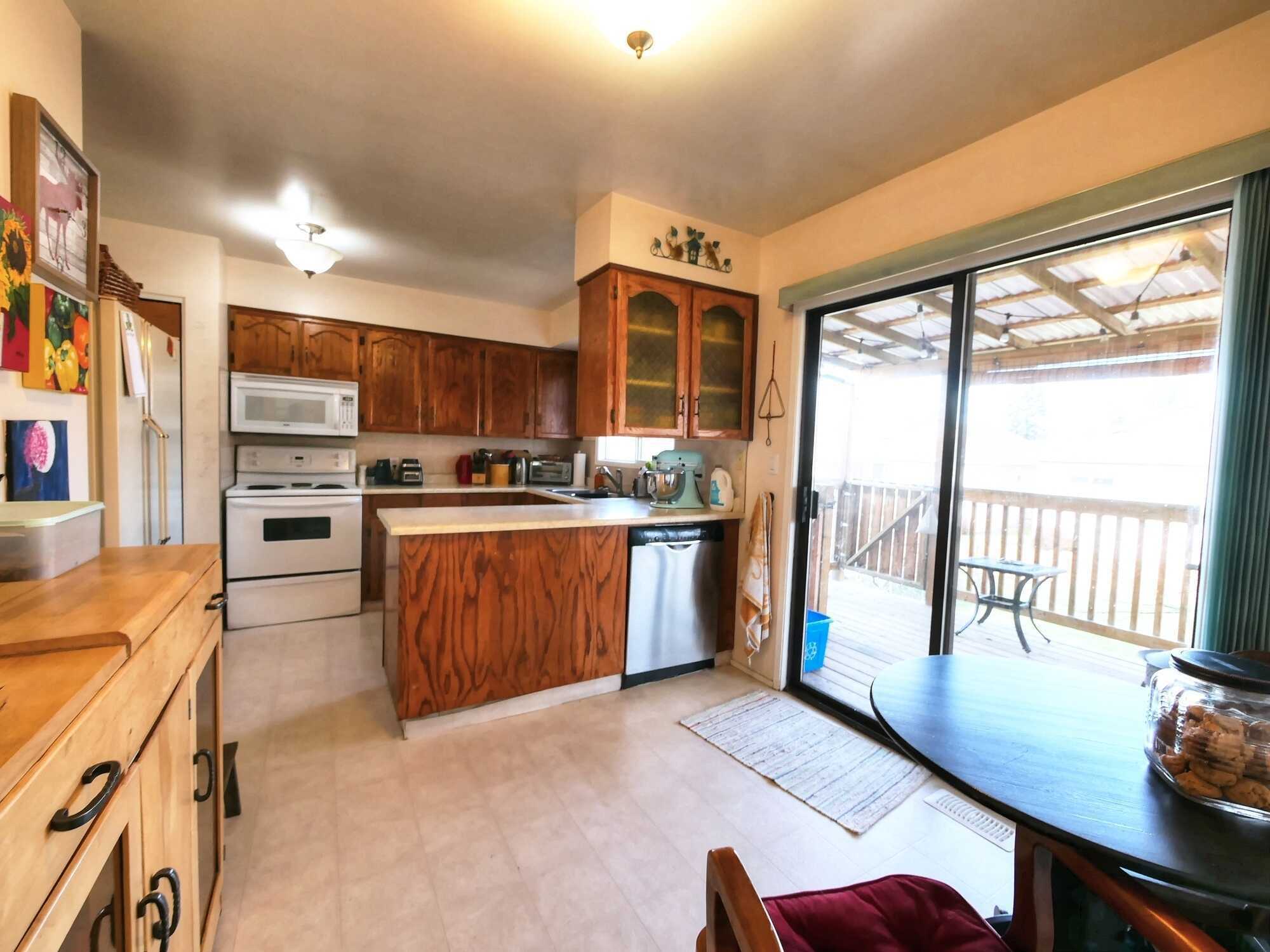 WELL MAINTAINED 3-4BED  2.5Bath Family Home in a great neighbourhood in Creston!  Attached Garage! Large Backyard and GREAT Covered Deck!  GREAT PRICE!!! 3