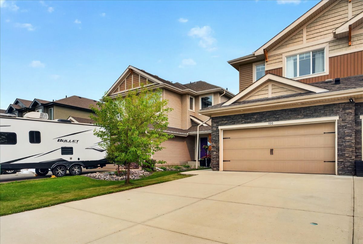 IMMACULATE 1,532 sq. ft. two-storey half duplex with a DOUBLE ATTACHED GARAGE and a 33 FT. DRIVEWAY, in sought after McLaughlin. 4