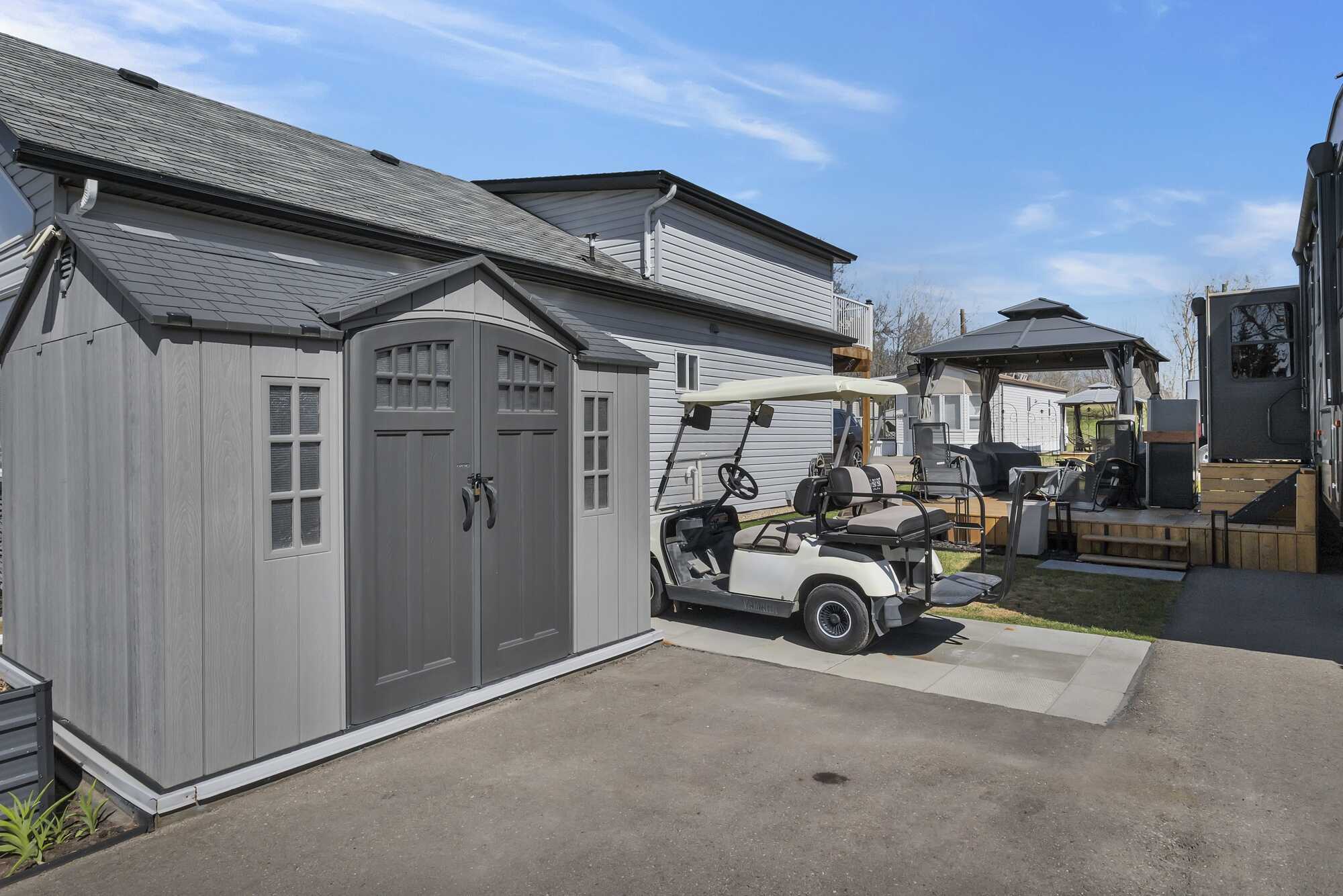 IMMEDIATE POSSESSION! PRICE REDUCED! Lake life at one of Alberta's most sought-after lakes & golf communities!This lake lot includes a 2019 Keystone Cougar 5th wheel Trailer & more ~ Whispering Pines Golf and Country Club Resort ~ 18 Hole Golf Course 5