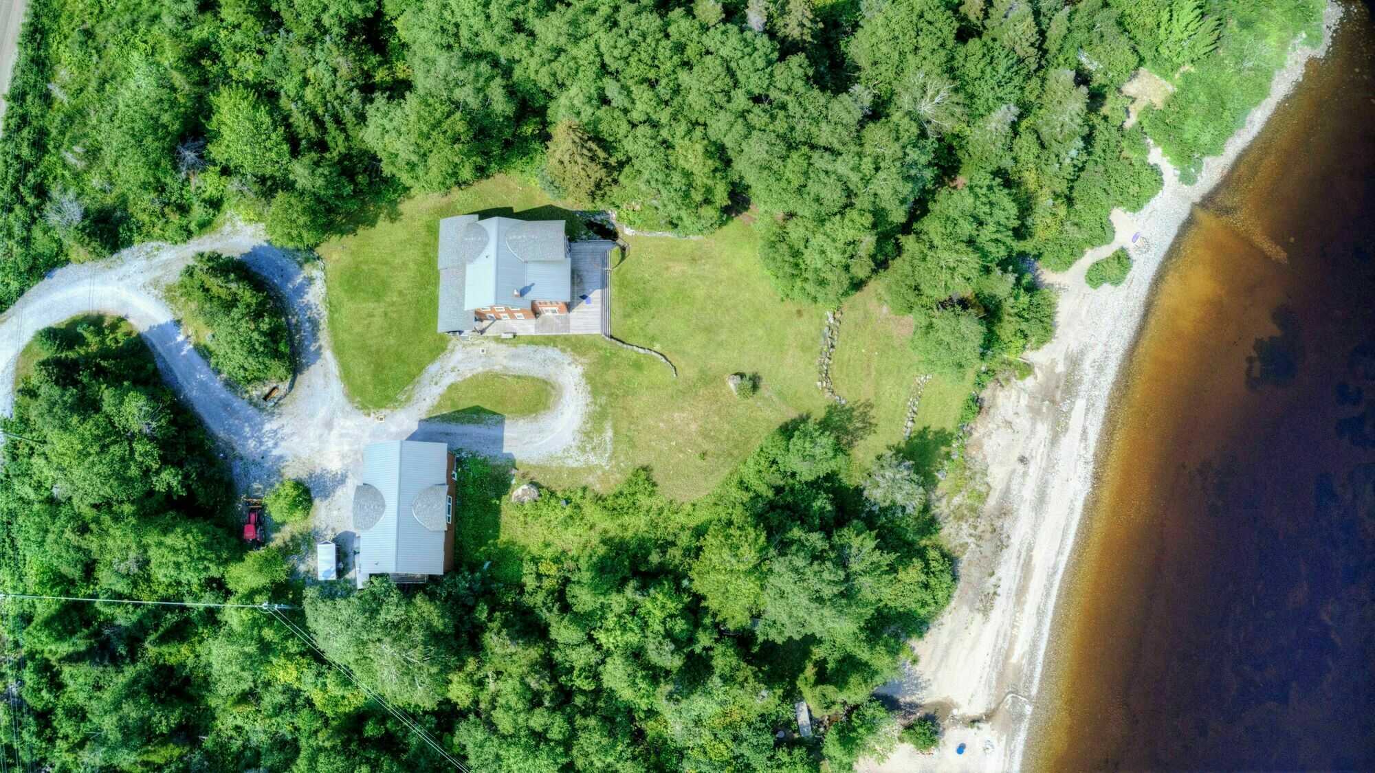 Located between Pasadena and Little Rapids in the heart of the Humber Valley. This unique one-acre lakefront property sits in a cove sheltered from the prevailing westerly wind and slopes gently down to a secluded beach. 2