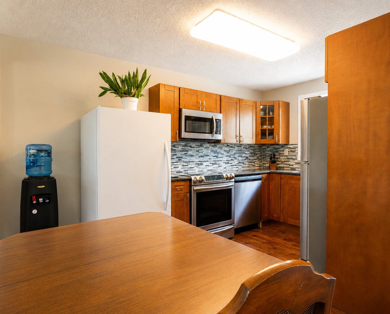 Updated 4-Bedroom North Glenmore Townhome in Kelowna with 2 Kitchens & Separate Entrance 4
