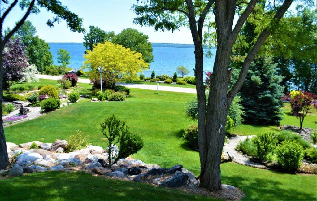 VTB MORTGAGE AT BELOW MARKET RATES on Georgian Bay waterfront property with Pier and Concrete Dock located in prestigious Sutacriti Park.   Manicured landscaping with Pond.  Nearly 3400 sq ft of luxury living space with separate entry In-law Suite. 3