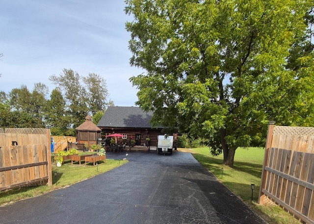 Rustic Charm Meets Modern Comfort. Your dream log home awaits, with every amenity to call your own retreat. This charming log home blends rustic character with modern comfort, set against a peaceful countryside. 2