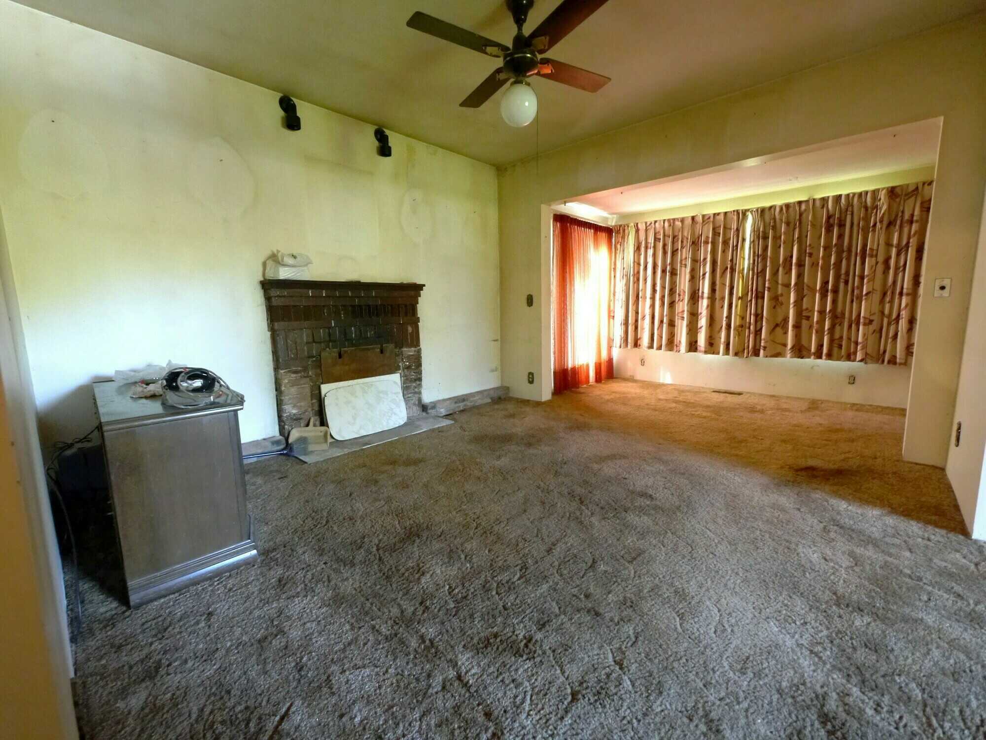POTENTIAL DEVELOPMENT!  PROJECT PROPERTY!  4Bed 1Bath home looking for love from someone who loves a challenge!  2 Titles and 0.5 acres approximately with a large outbuilding on a No Thru Road! 5