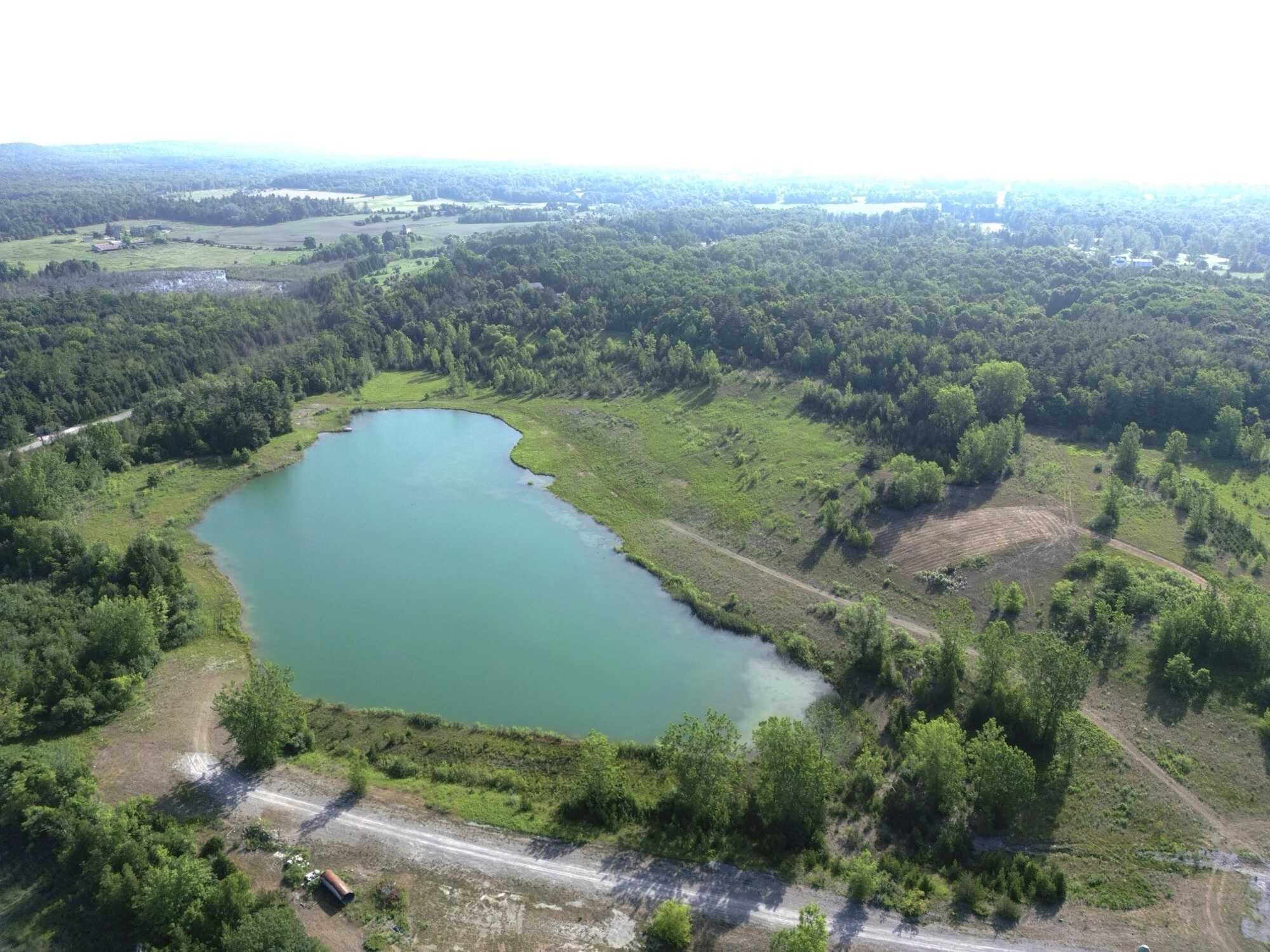 Prime 60 acres of pure potential just outside Brighton! Featuring a stunning 6-acre pond, rolling terrain, and multiple prime build sites, this peaceful retreat offers endless possibilities for your dream home with city convenience just minutes away. 5