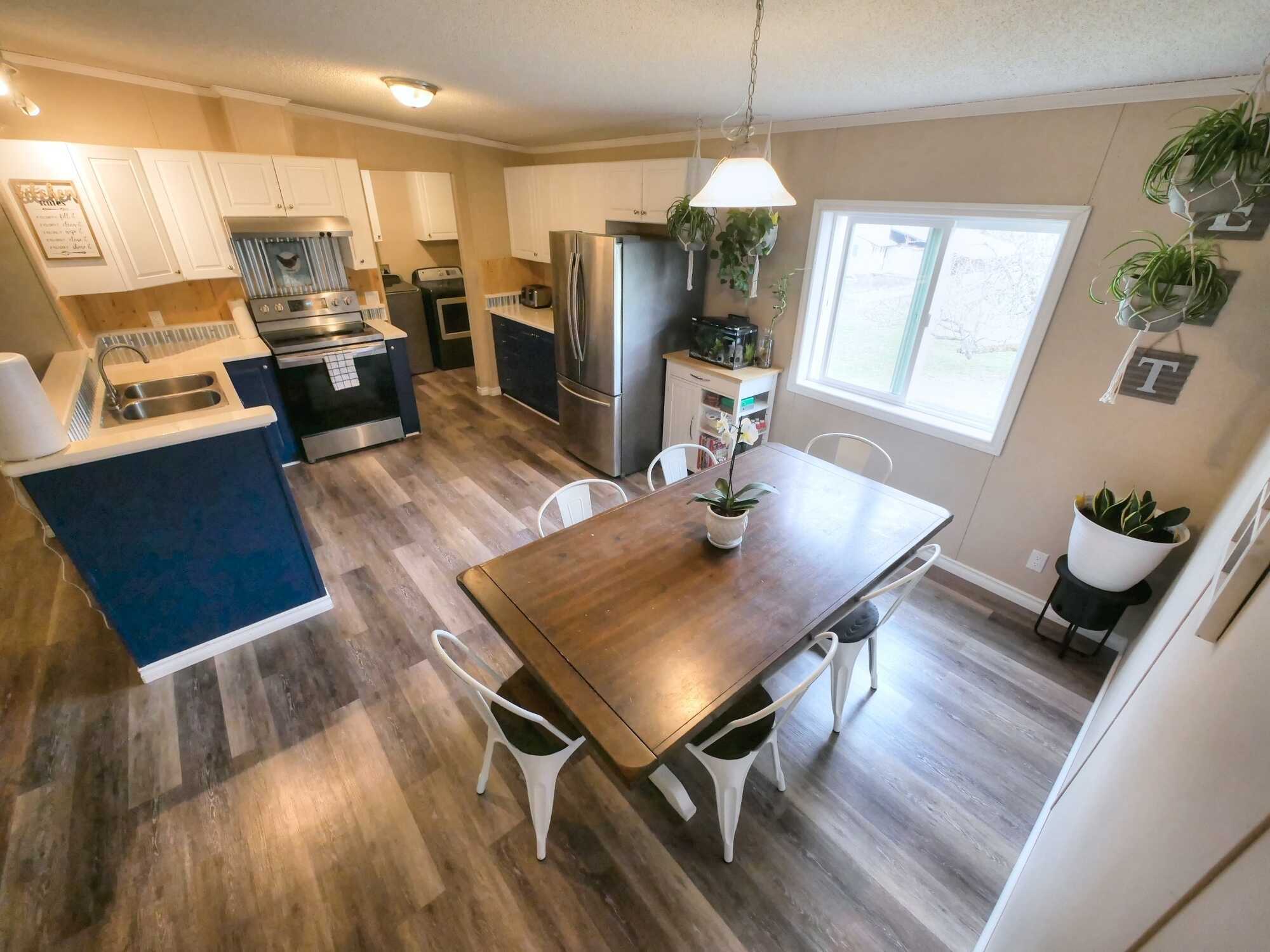 BEAUTIFUL MODULAR HOME ON 5 LEVEL ACRES! 3Bed 2Bath! Heated Garages/Shops, Barn & a Carport! Located between Montrose & Fruitvale! 2