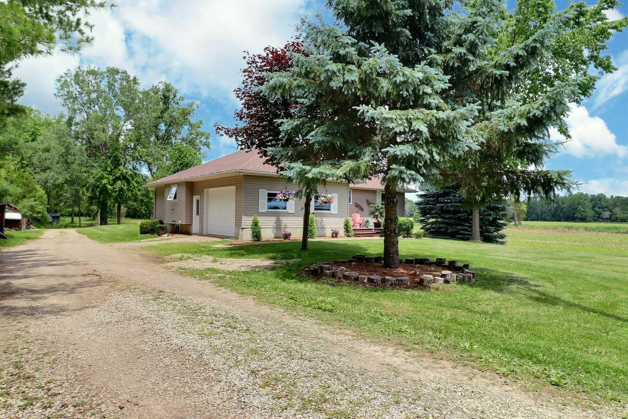 Escape the City to Your Own 5.02 Acre Country Paradise situated just outside of Dutton! 3
