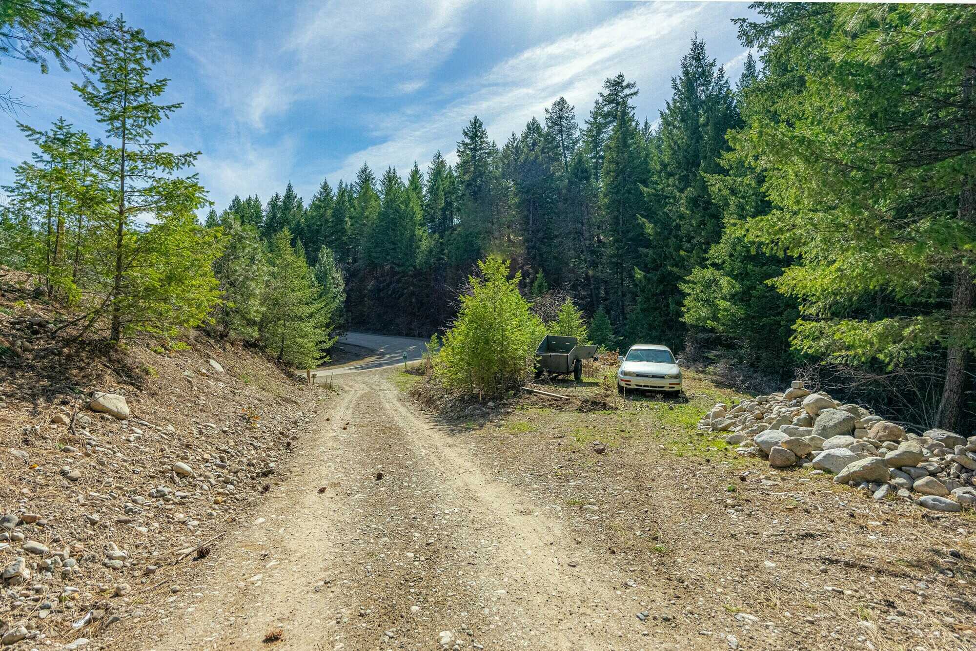 Beautiful, Open, Flat 2 acre lot in the heart of the Okanagan! Stones throw to the beach and backs onto crown land! 4