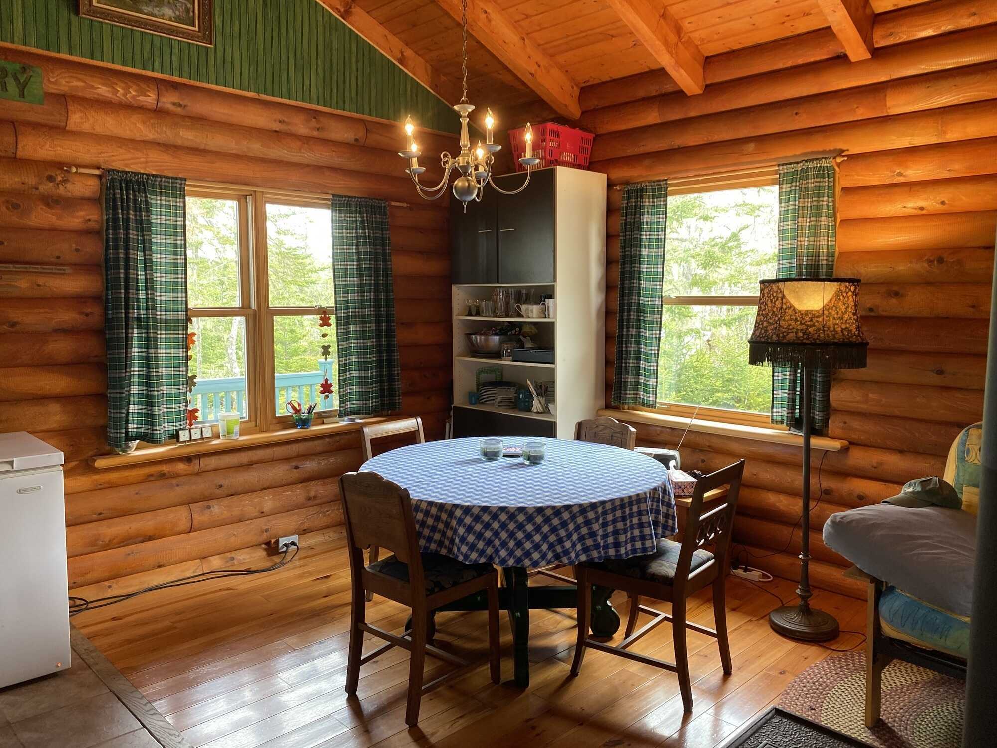 Log home in a quiet location! Lots of opportunity with more land available to purchase! 5