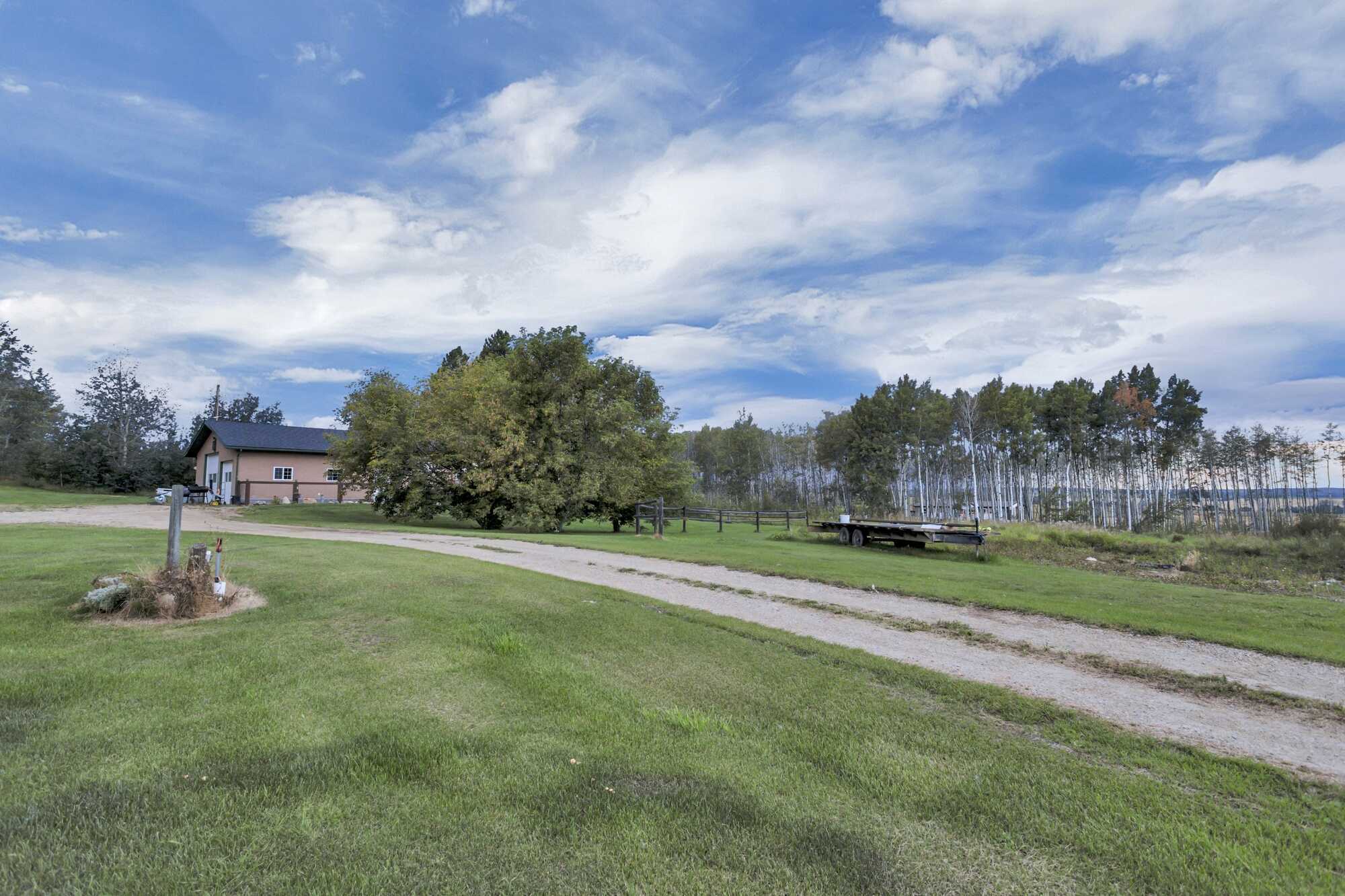 5.98 Acres ~ 5 Bed Bungalow With A/C ~ Oversized Triple Garage ~ 18'x55' Quonset 4