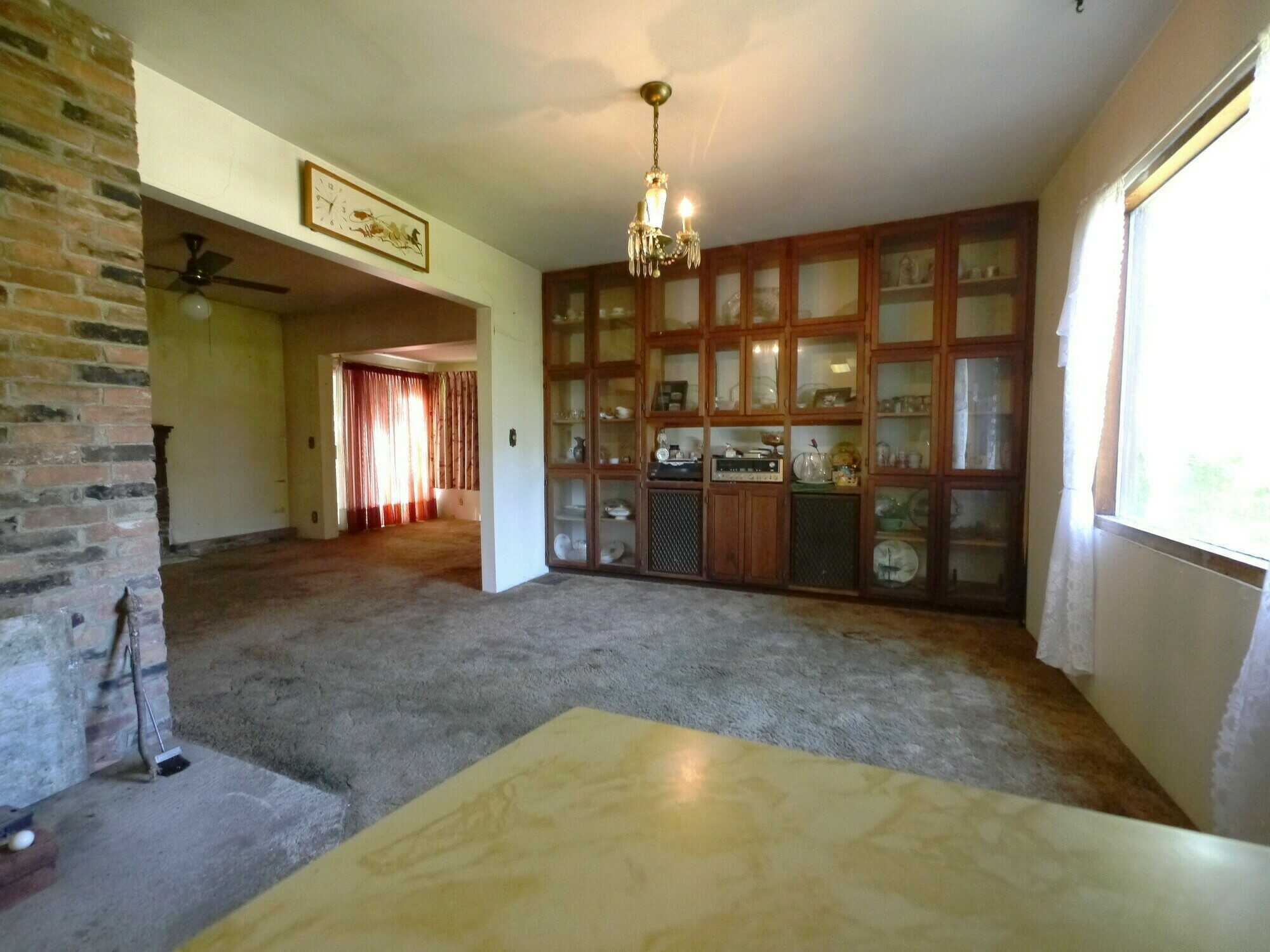 POTENTIAL DEVELOPMENT!  PROJECT PROPERTY!  4Bed 1Bath home looking for love from someone who loves a challenge!  2 Titles and 0.5 acres approximately with a large outbuilding on a No Thru Road! 4