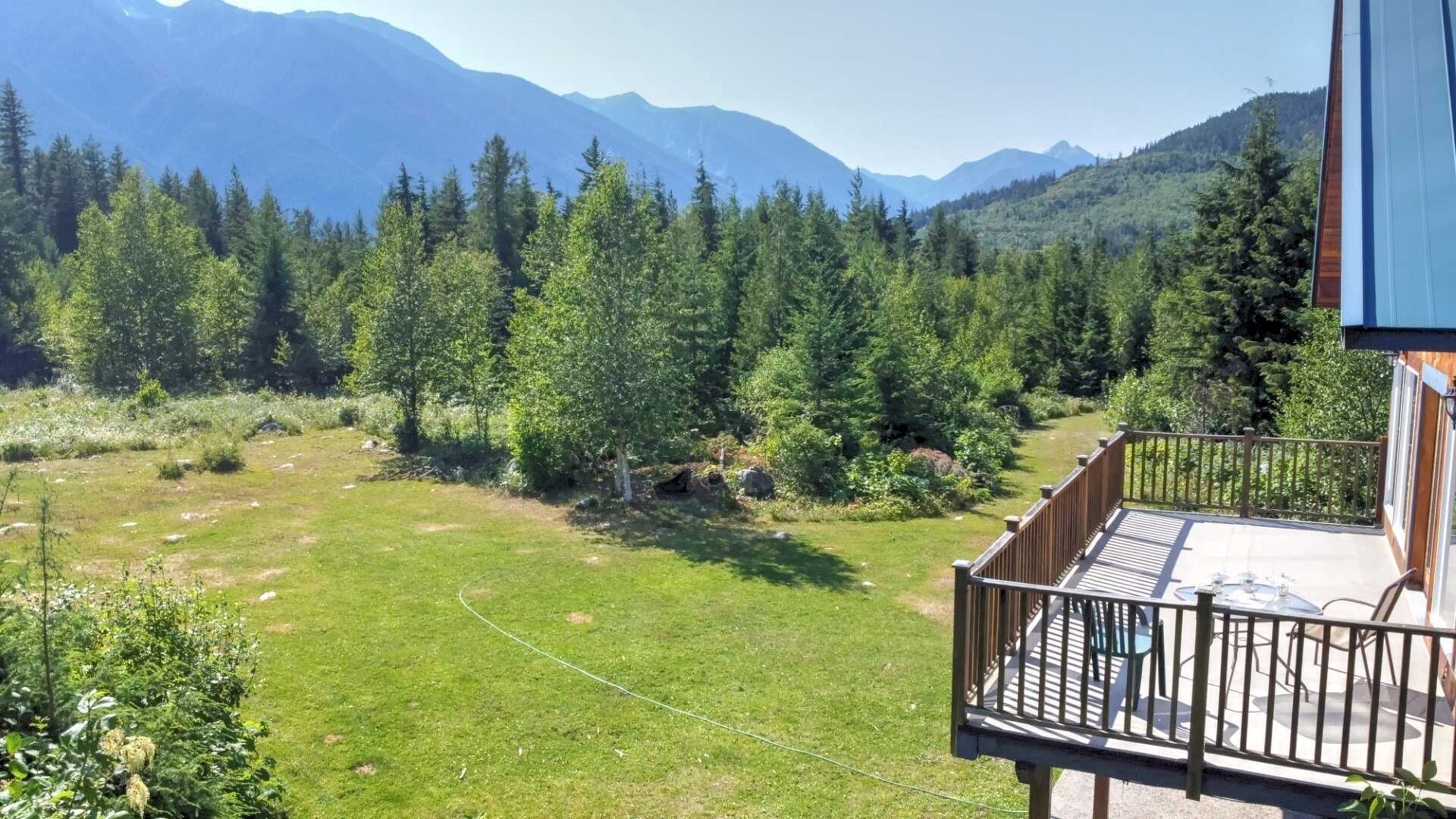 APPROX 28 ACRES! Stunning location! GORGEOUS 4Bed 2Bath Home! 2 min drive to Slocan Lake! Studio building! Potential Farm! 2