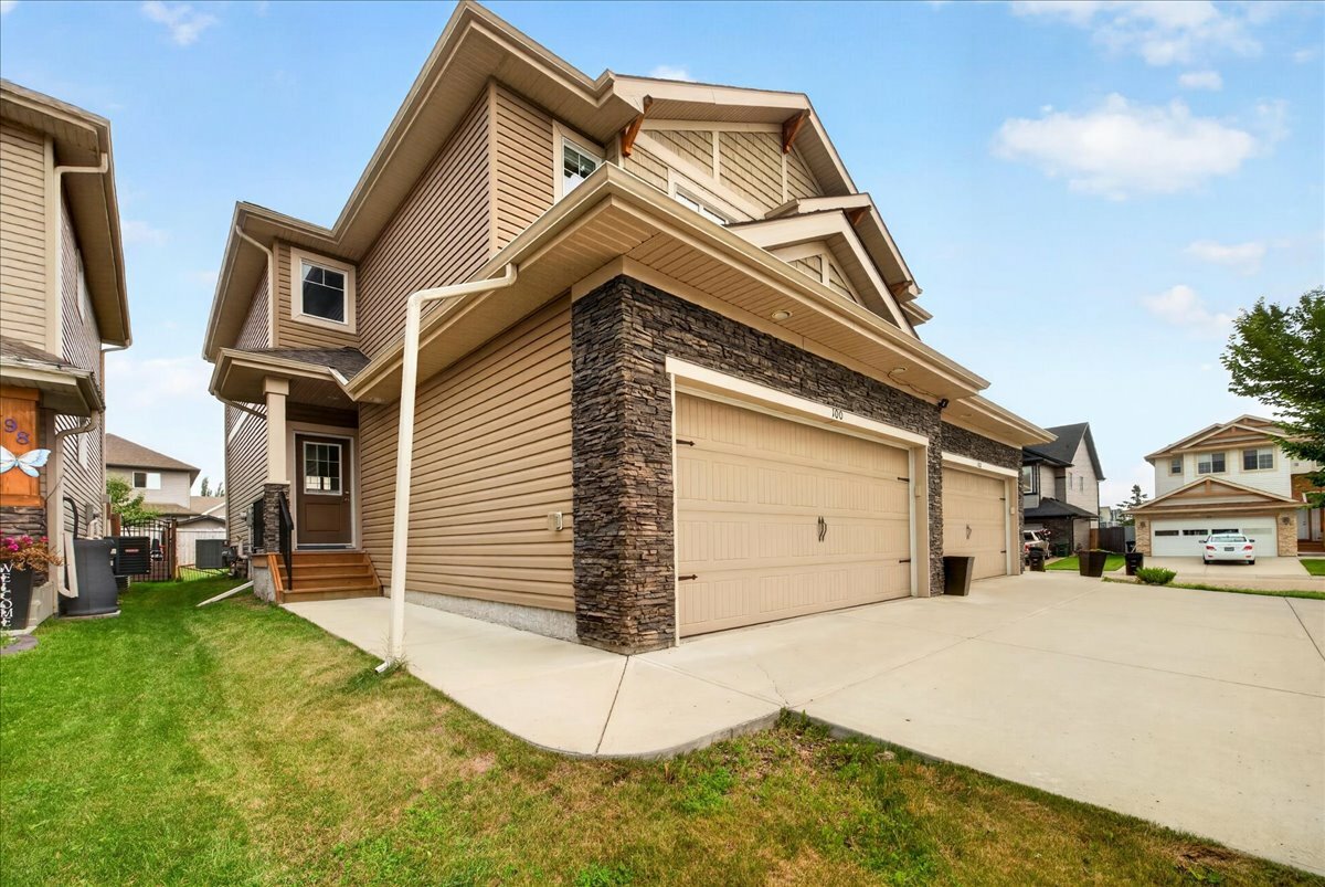 IMMACULATE 1,532 sq. ft. two-storey half duplex with a DOUBLE ATTACHED GARAGE and a 33 FT. DRIVEWAY, in sought after McLaughlin. 5