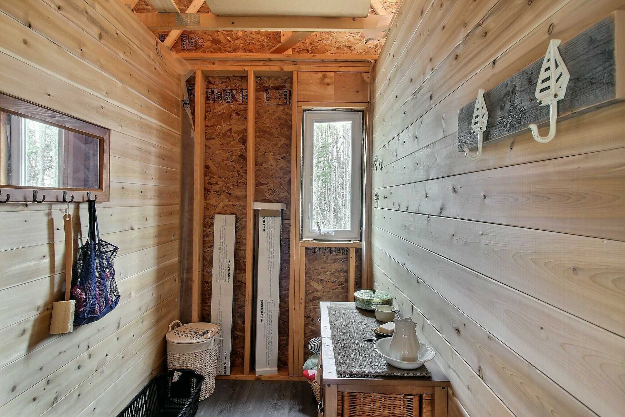 5 ACRE WATERFRONT parcel with a nearly finished 24 x 40 cabin that has a 12 x 40 deck overlooking the water. 4
