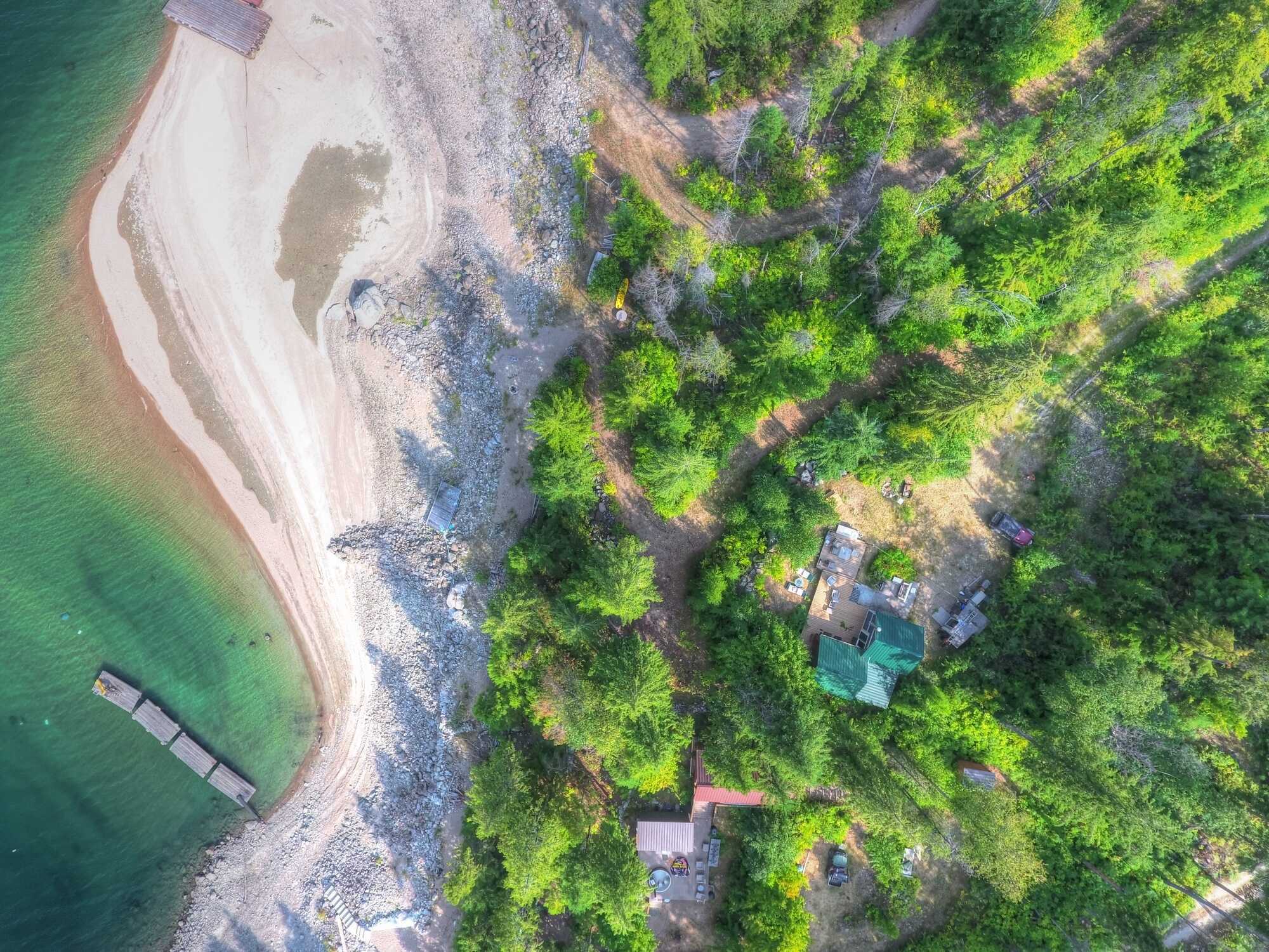 WATERFRONT off-grid cabin on 6.46 acres with an incredible 246 feet of beach! Right on Arrow Lake, 33km from Castlegar across from Deer Park. Peaceful & private property of your dreams - you won't find another anything like it in this price range! 4