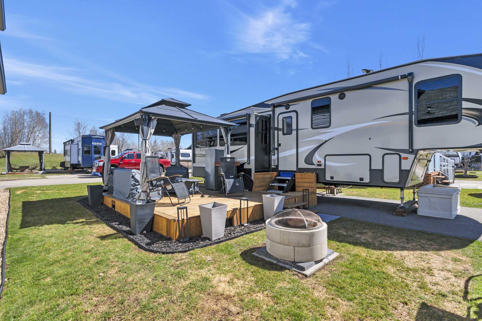 IMMEDIATE POSSESSION! PRICE REDUCED! Lake life at one of Alberta's most sought-after lakes & golf communities!This lake lot includes a 2019 Keystone Cougar 5th wheel Trailer & more ~ Whispering Pines Golf and Country Club Resort ~ 18 Hole Golf Course 3