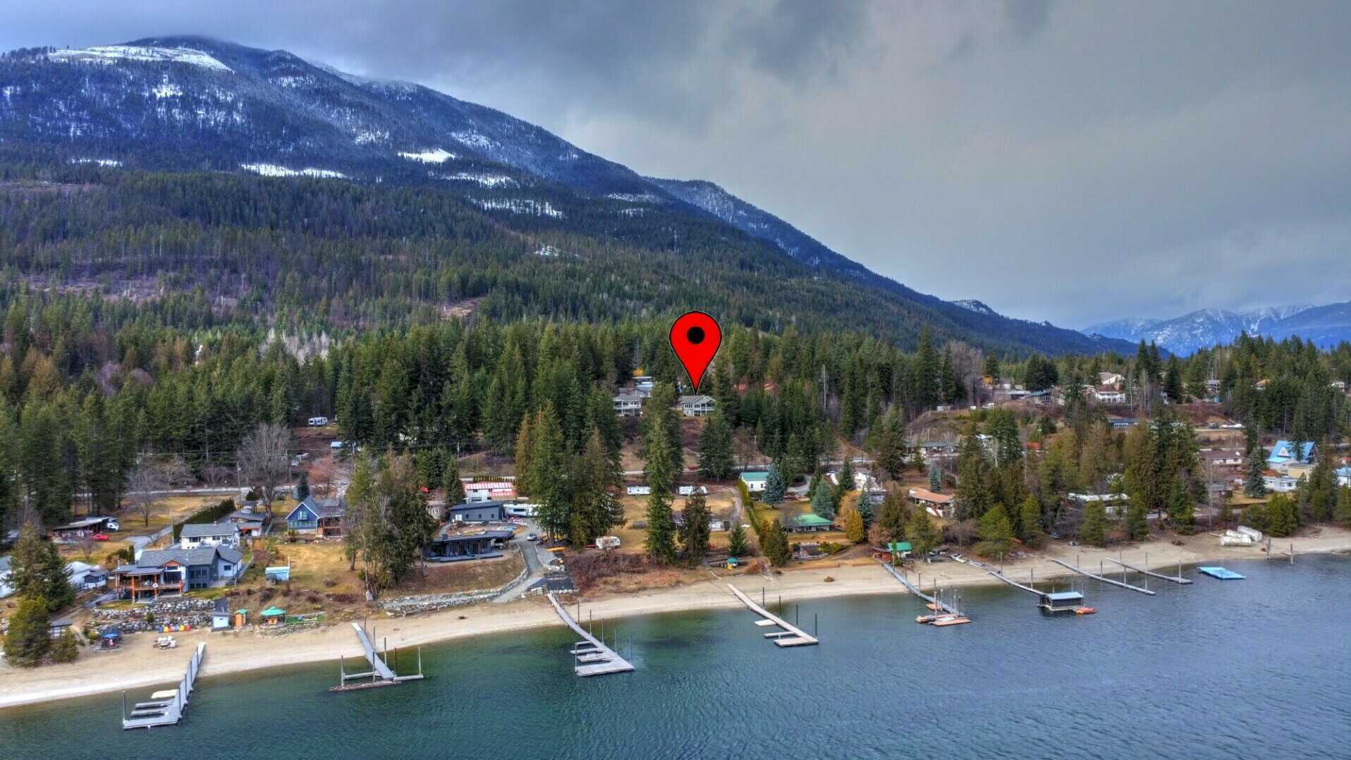 NEW PRICE! KOOTENAY LAKE VIEW. GORGEOUS!! PANORAMIC KOOTENAY LAKE VIEW FAMILY HOME 4BED+ 3BATH! with 2 Bed Suite Potential & a 1 Bed Studio Potential for extra income or Extended Family Living, 1/2 acre of GORGEOUS landscaped property! MUST SEE 4