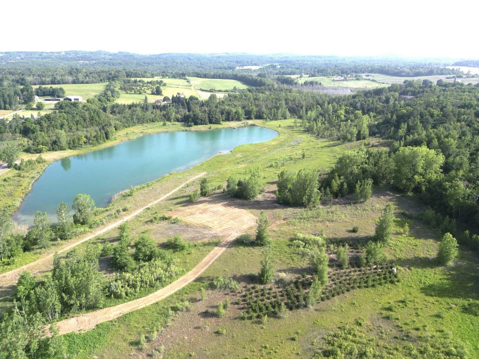 Prime 60 acres of pure potential just outside Brighton! Featuring a stunning 6-acre pond, rolling terrain, and multiple prime build sites, this peaceful retreat offers endless possibilities for your dream home with city convenience just minutes away. 2