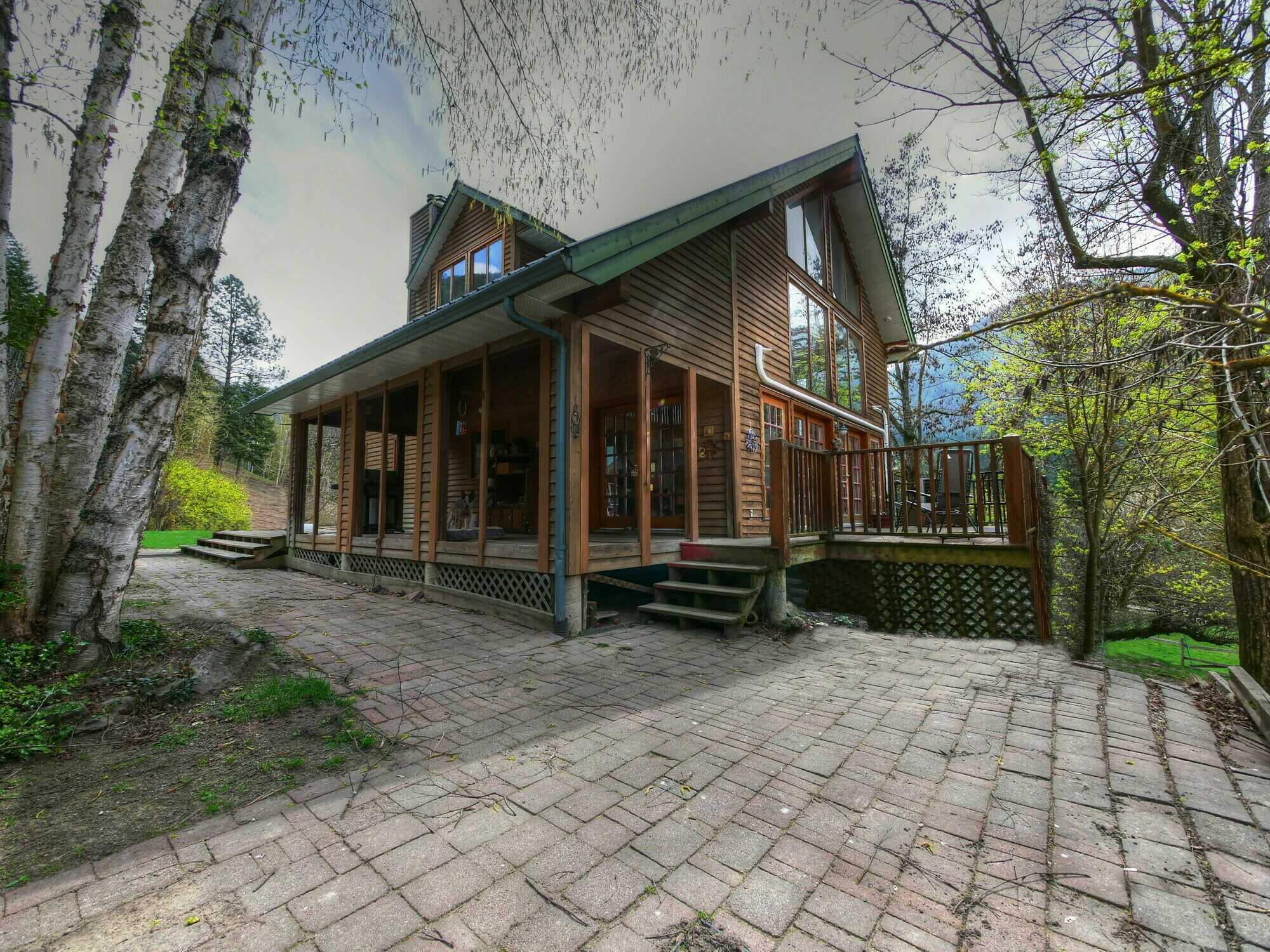 South end of Beautiful Slocan Valley in Slocan Park! Amazing Country Home 4 Bed/3 Bath on 16.33 Fabulous acres!  Garage Shop Barn & More! Ready for farming! 2