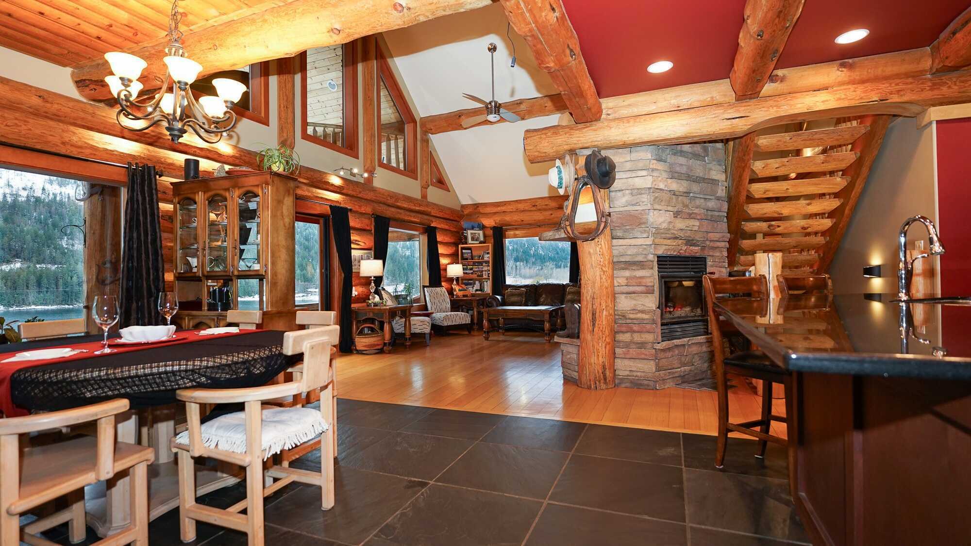 A breathtaking lakefront log cabin on Adams Lake. Custom built and thoughtfully designed, this exceptional home sits on 0.53 acres and offers 3,190 sq ft of beautifully crafted living space, blending rustic character with refined comfort. 4