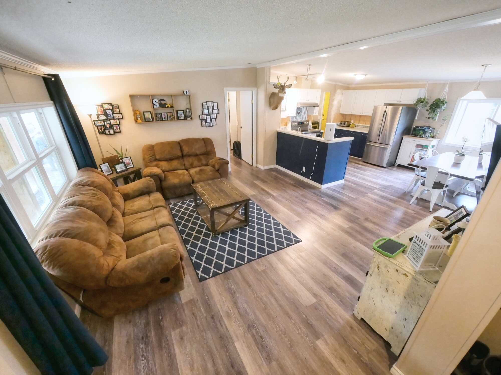 BEAUTIFUL MODULAR HOME ON 5 LEVEL ACRES! 3Bed 2Bath! Heated Garages/Shops, Barn & a Carport! Located between Montrose & Fruitvale! 3