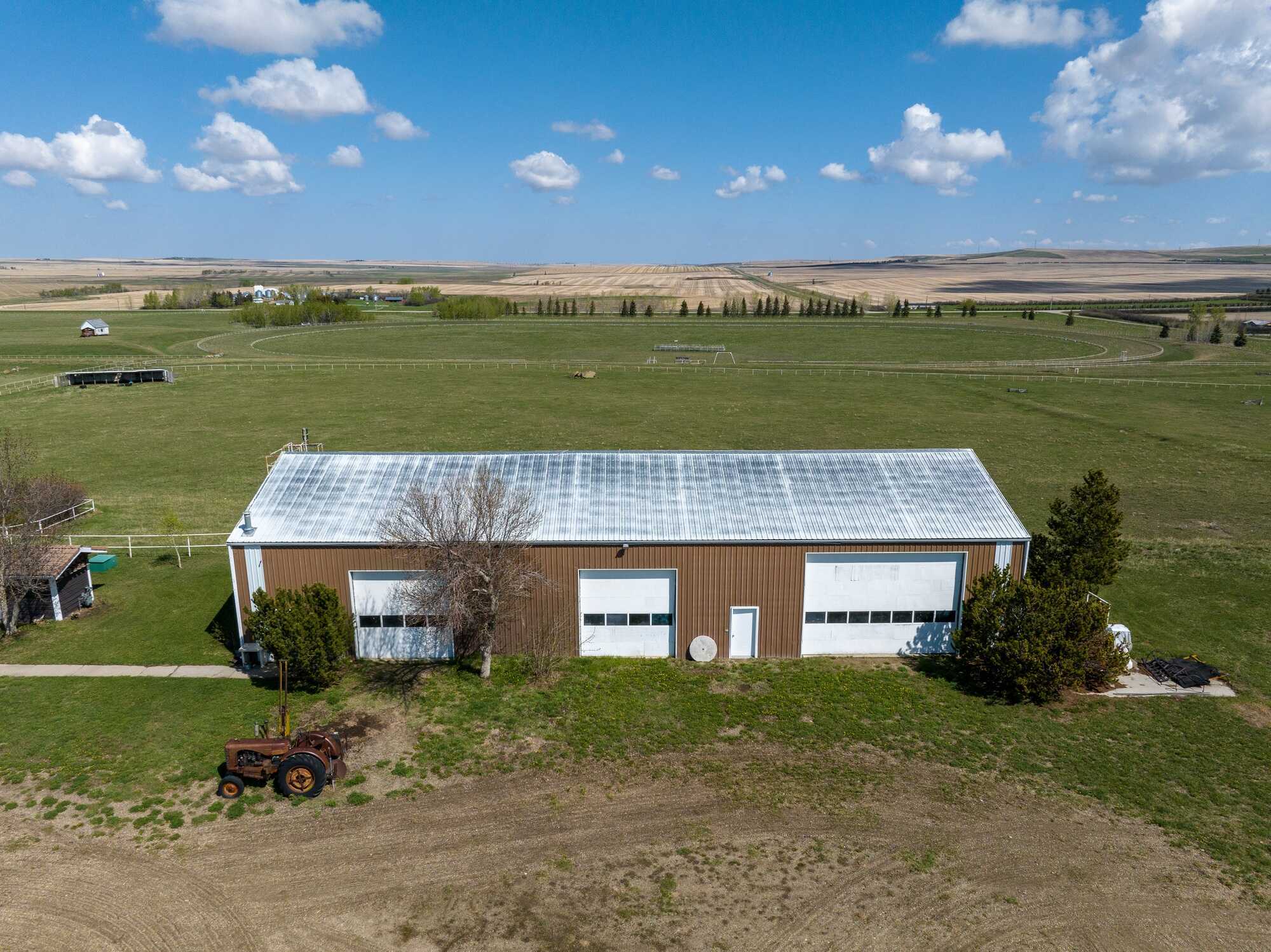 Full quarter section of luxury living, equestrian facilities, and natural beauty! 3