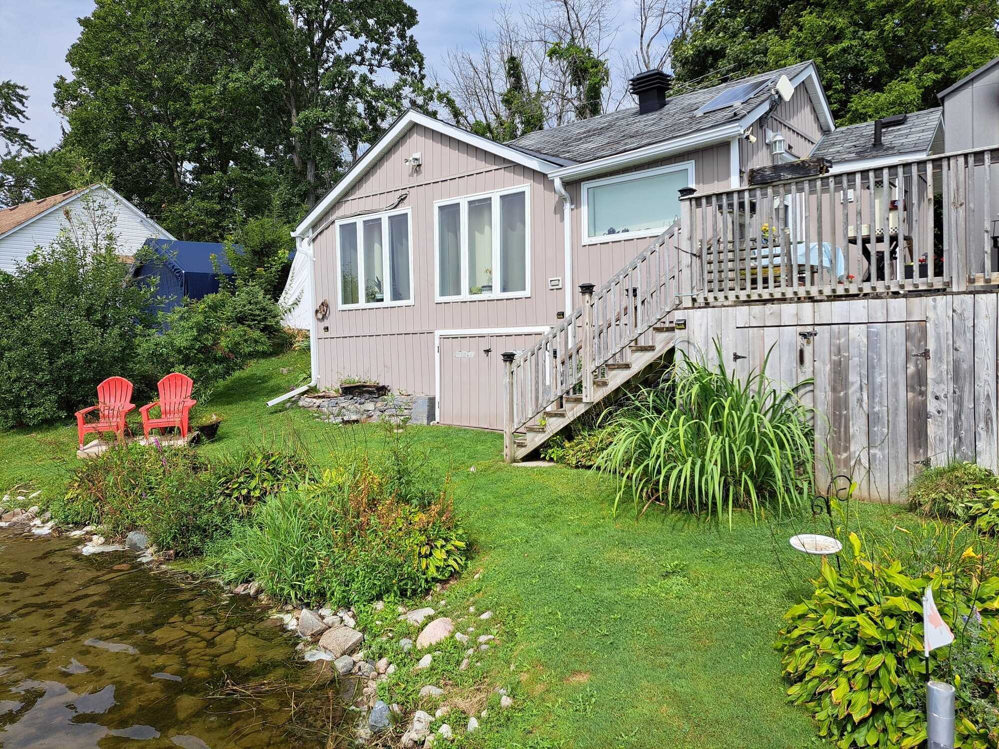 A rare opportunity to own a slice of paradise where relaxation and practicality meet. Delightful, cozy home in a beautiful, peaceful setting on the Trent-Severn Waterway on Bradley Bay, ideal for boating, fishing, canoeing, and more. 2