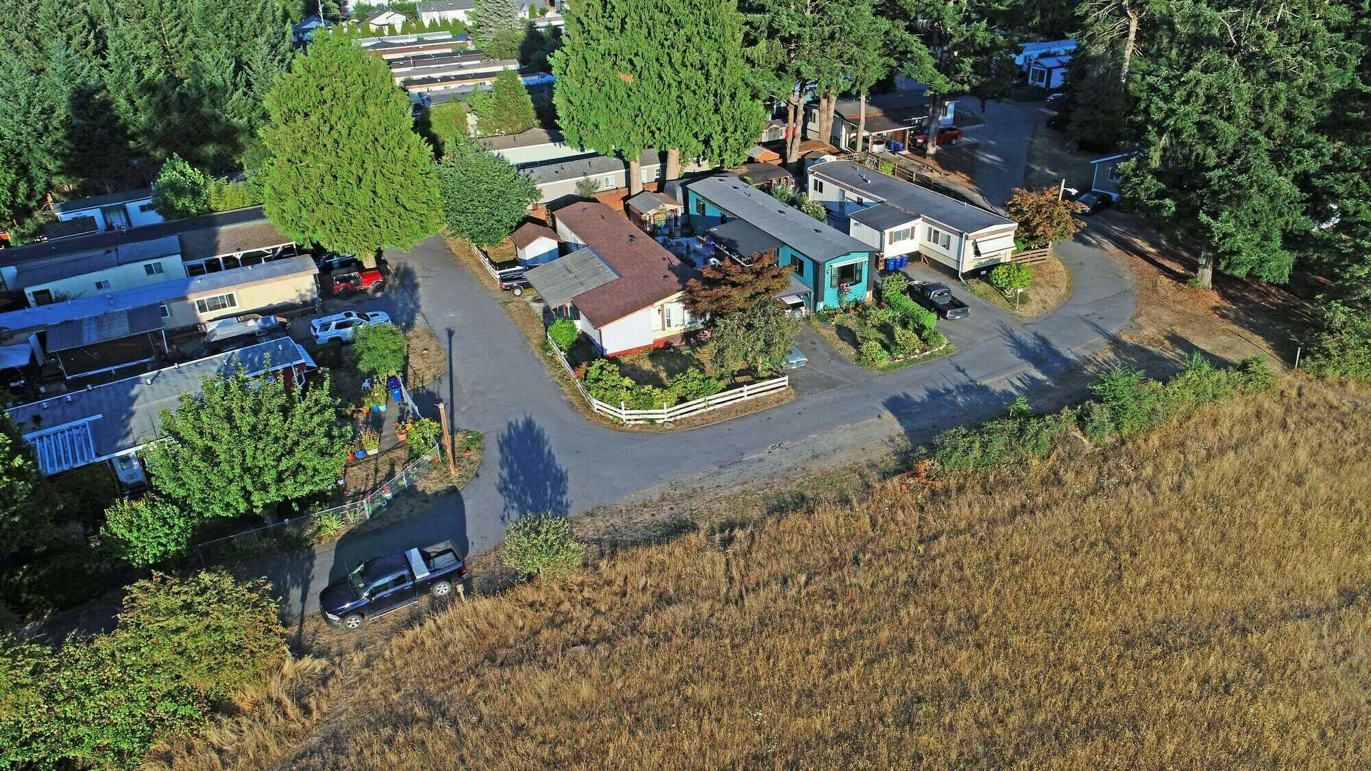 Just Listed ! An affordable 1100 sq.ft 3 bedroom 1 bathroom mountain view home, with additional bedroom off the kitchen, in the great family location of the Parklane Manufactured Home Park. 4
