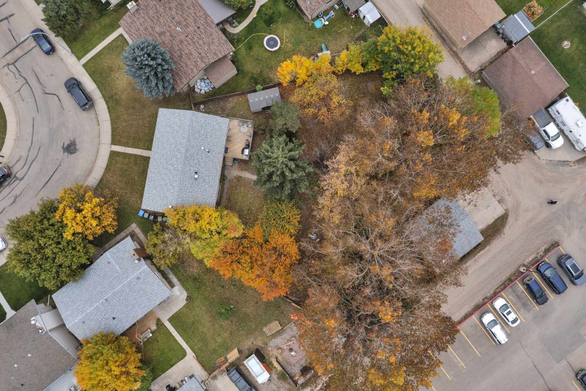 Great Investment Opportunity ~ Pie Shaped Lot ~ Bi-Level ~ 2 Independent Living Spaces ~ Double Detached Heated Garage ~ Across From Green Space 2
