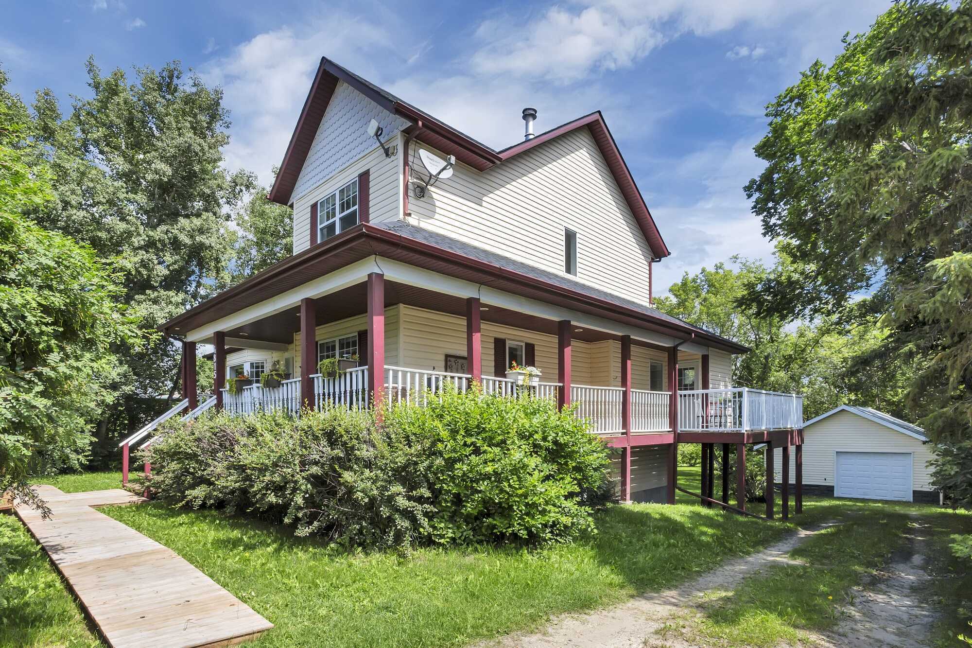Timeless Character ~ Modern Comfort ~ 2-Storey ~ Six Bedrooms ~ Double Detached Garage ~ Private, Park-Like Setting 3