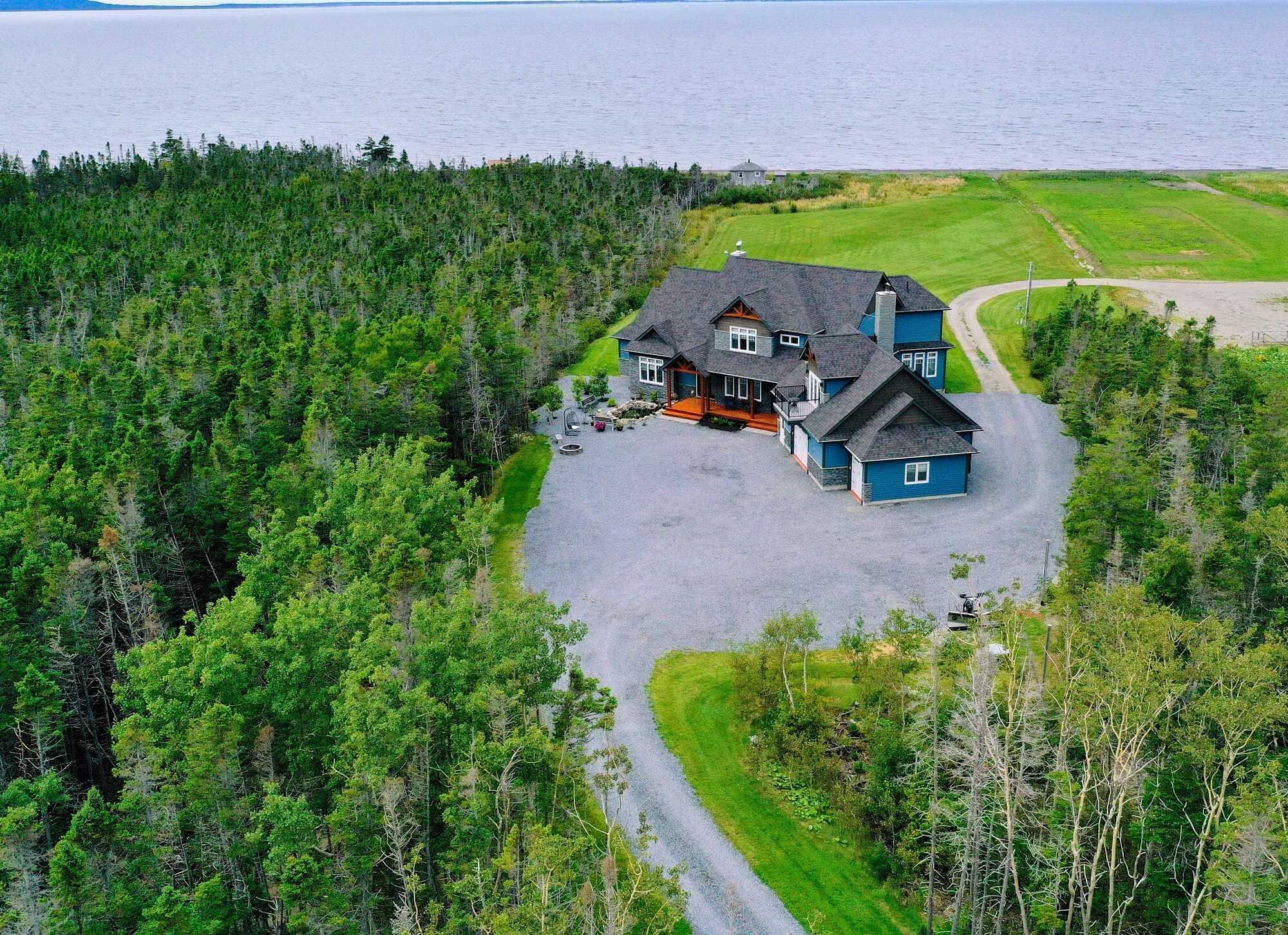Welcome to this exquisite oceanfront executive home, where luxury meets sustainability. 2