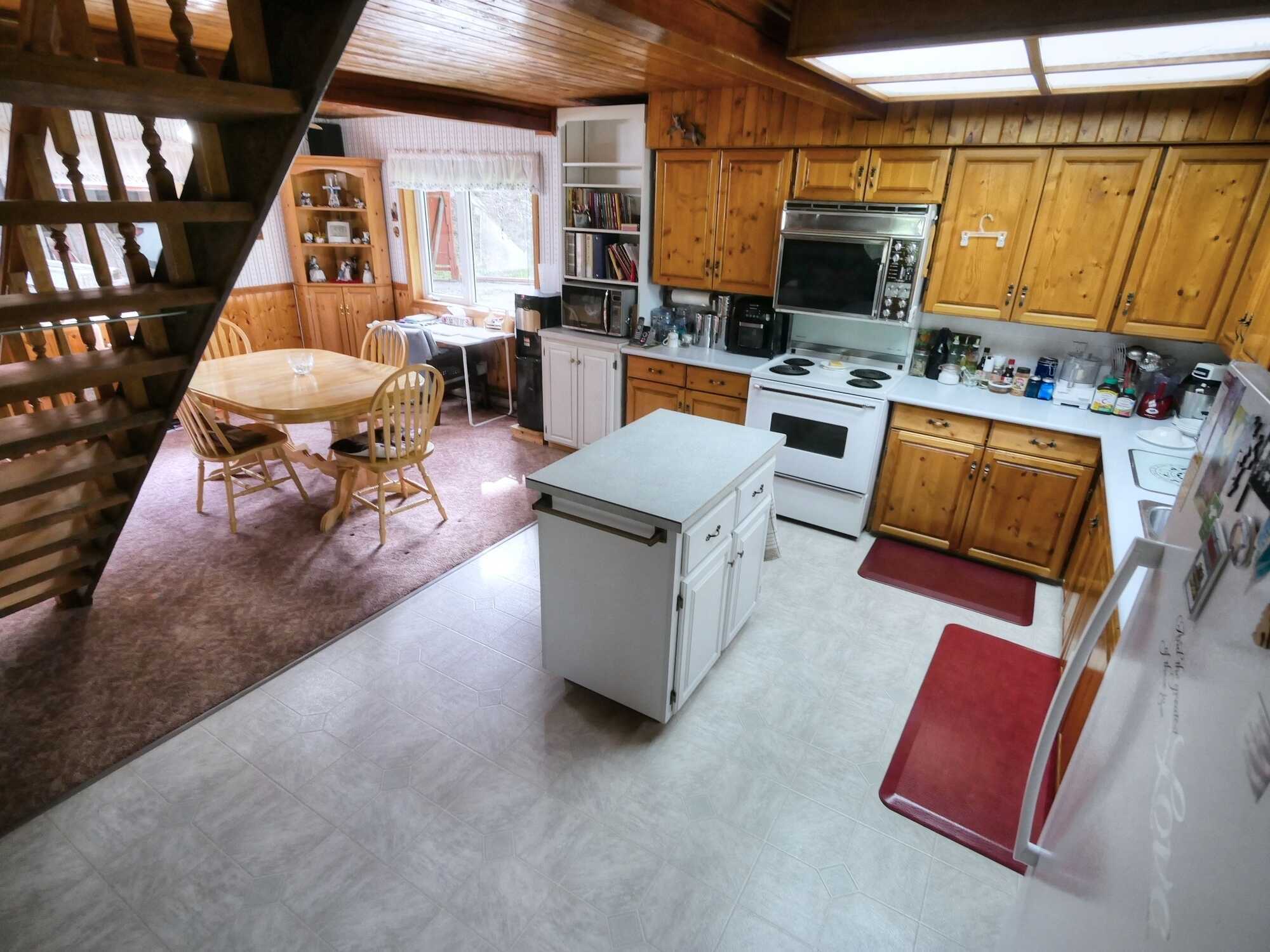 Rural Creston property!  Charming Country Home 2/3 Bed 2 Bath! Carport & Small Shop! Nearly ½ Acre Lot!  PRIVATE & Backs onto Crown Land! 2