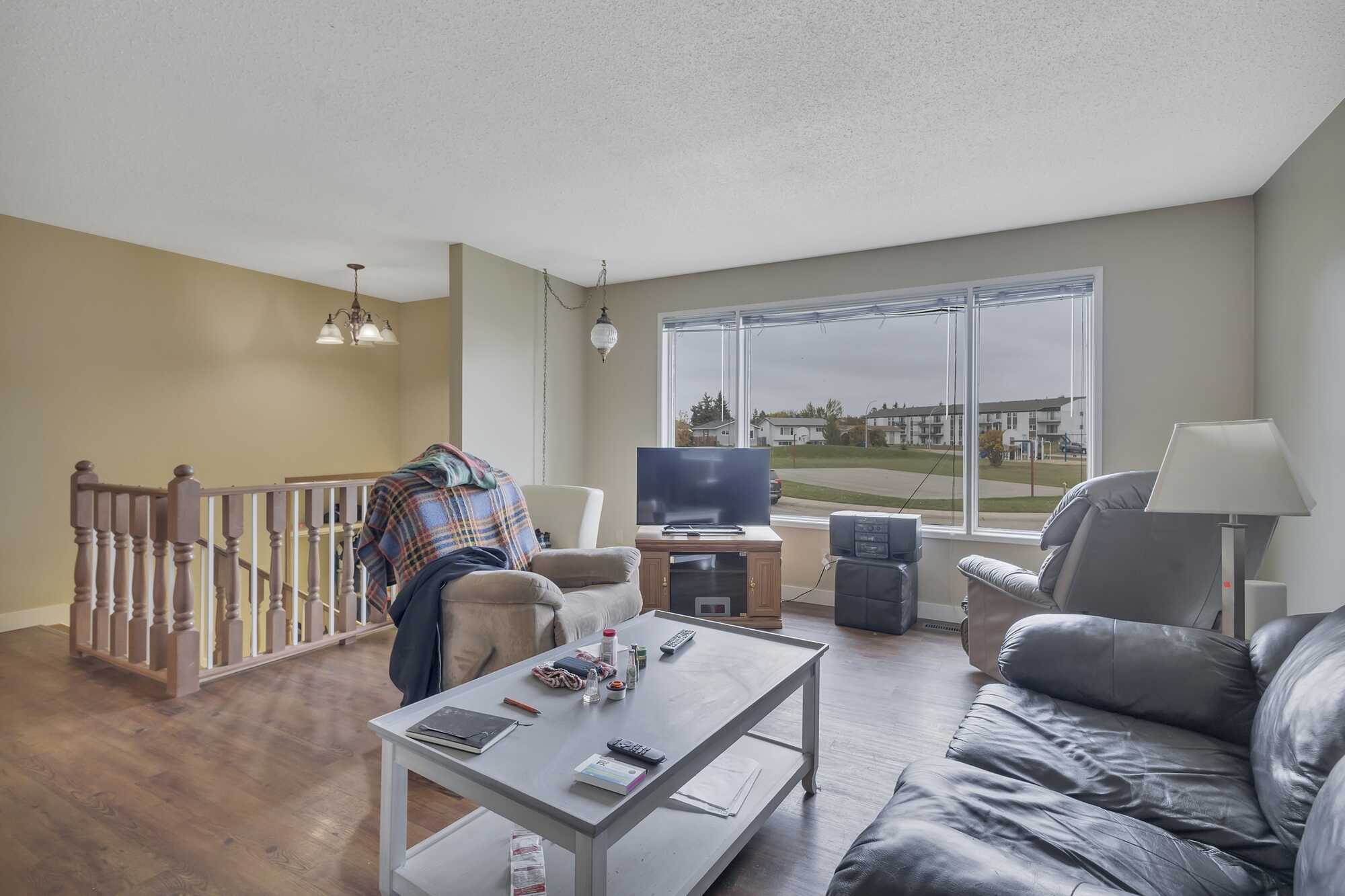Great Investment Opportunity ~ Pie Shaped Lot ~ Bi-Level ~ 2 Independent Living Spaces ~ Double Detached Heated Garage ~ Across From Green Space 5