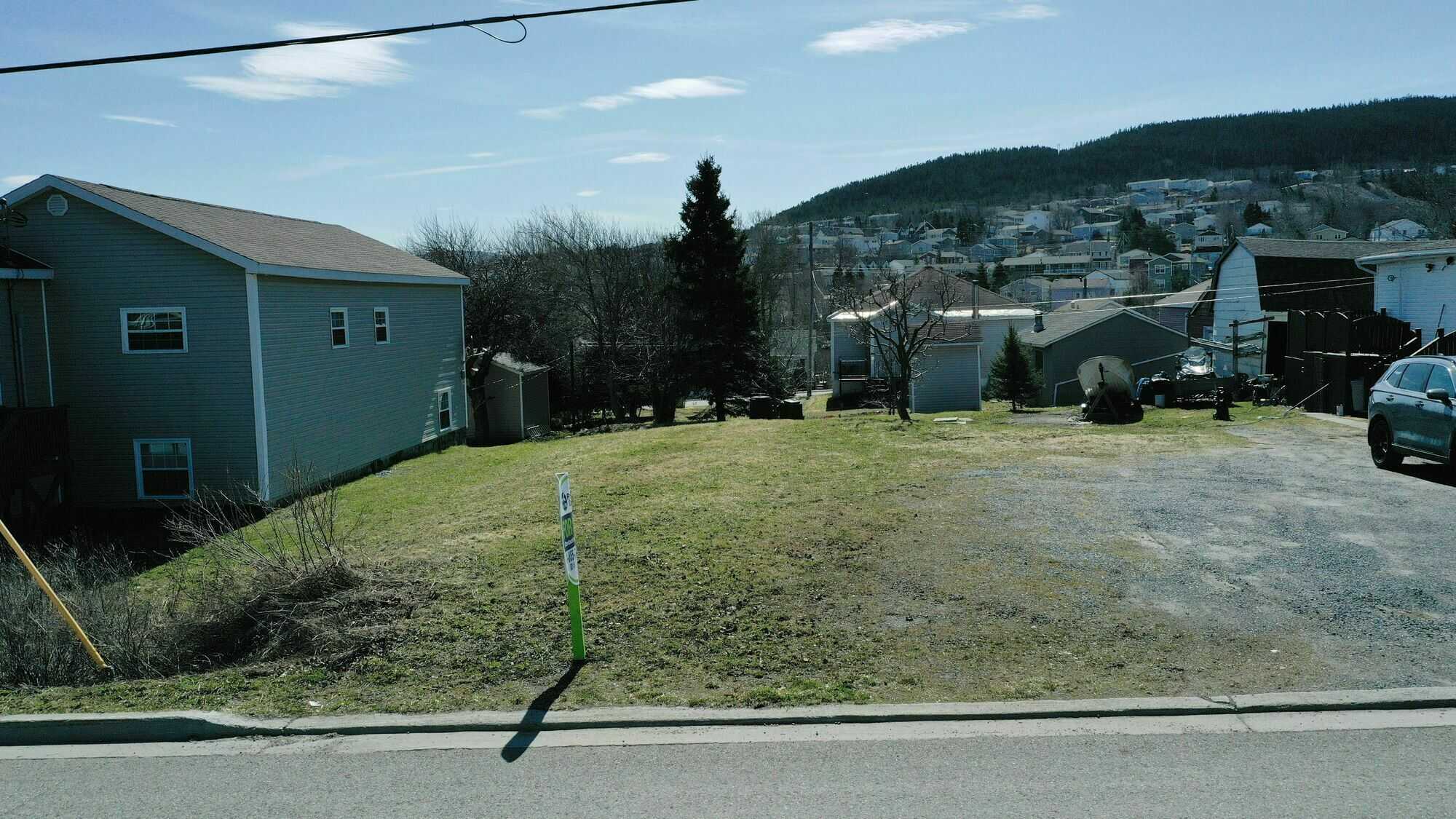 For sale: Prime vacant land, measuring 50 feet by 100 feet, offering a blank canvas for your dream project 5