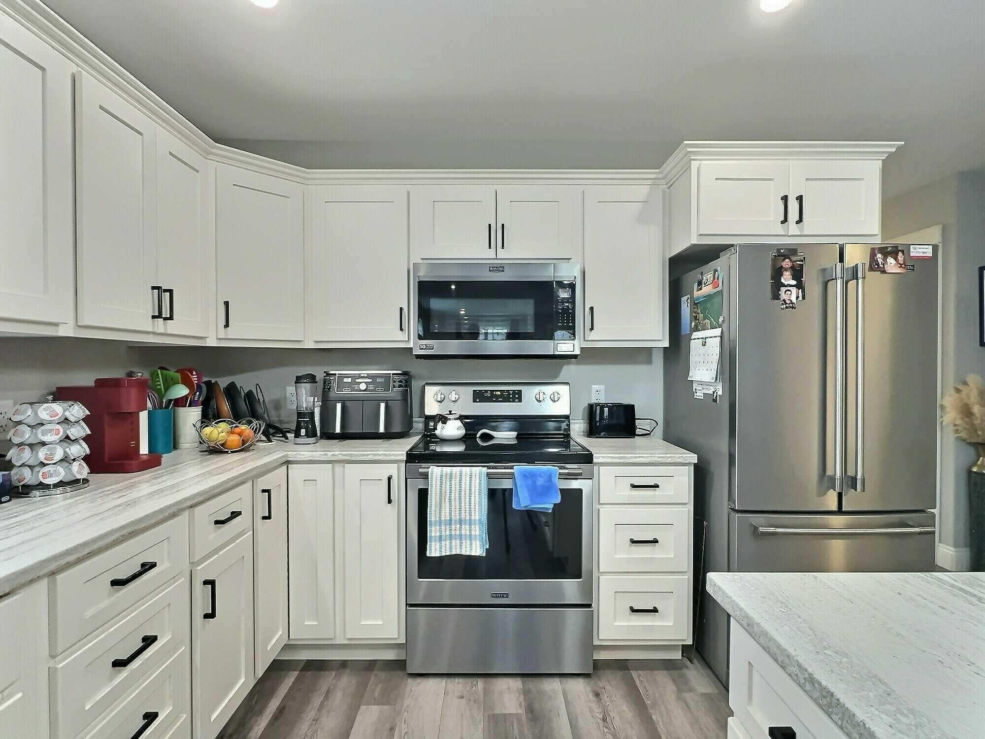 Perfect for retirees or those looking to downsize, this beautiful 2-bedroom semi-detached home with attached garage is located in a sought-after 55+ neighborhood! 4