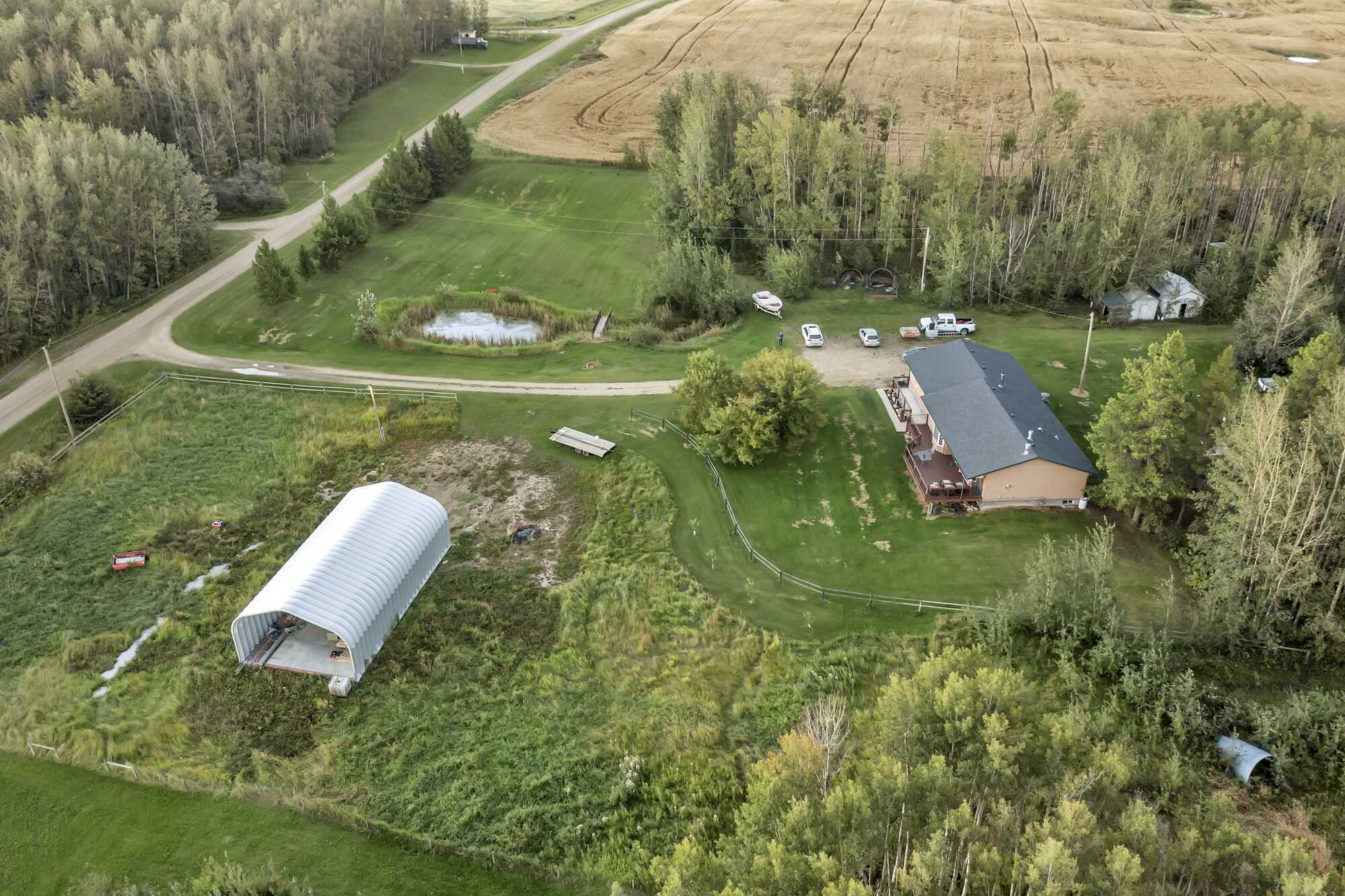 5.98 Acres ~ 5 Bed Bungalow With A/C ~ Oversized Triple Garage ~ 18'x55' Quonset 2