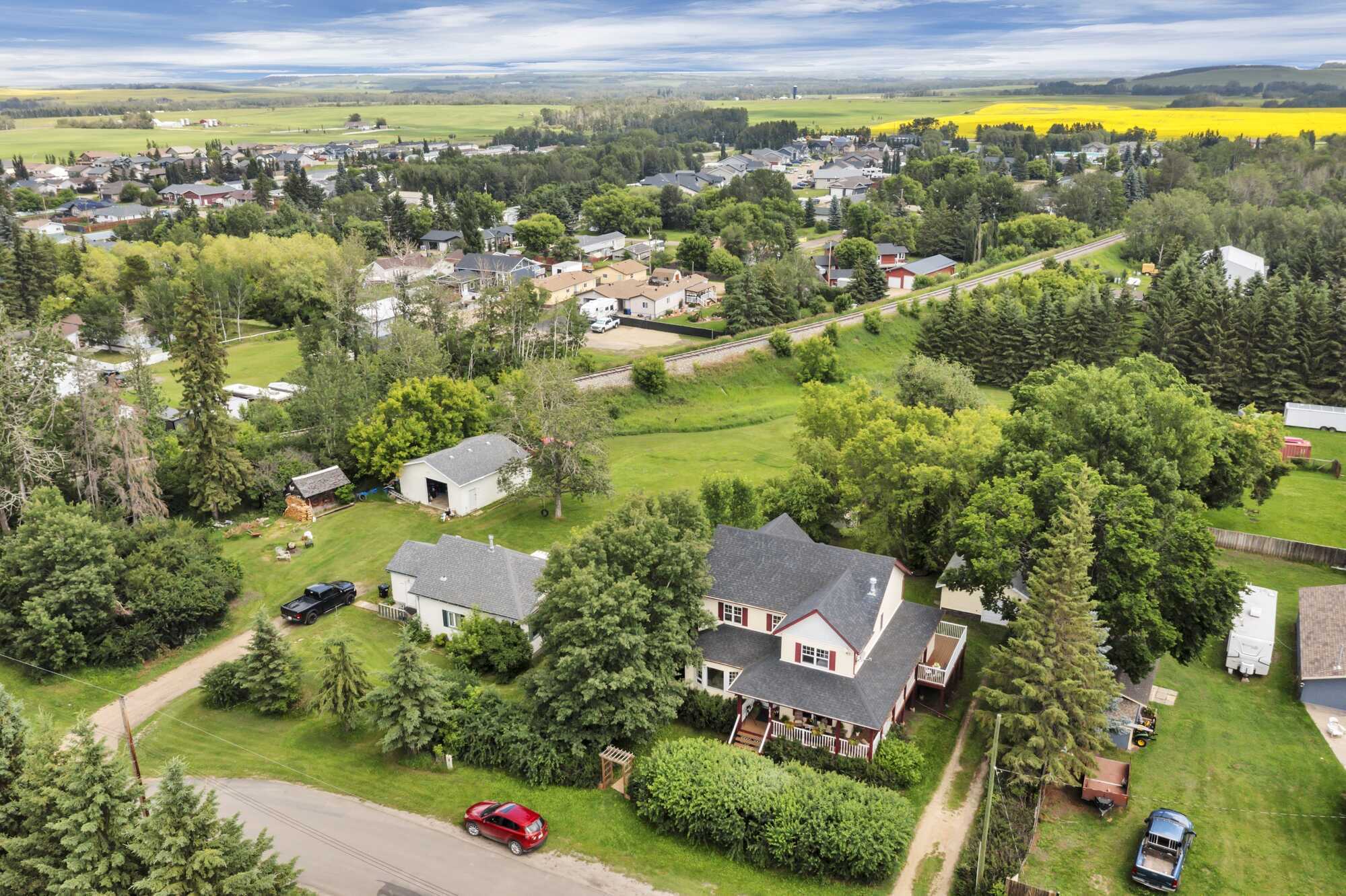 Timeless Character ~ Modern Comfort ~ 2-Storey ~ Six Bedrooms ~ Double Detached Garage ~ Private, Park-Like Setting 2