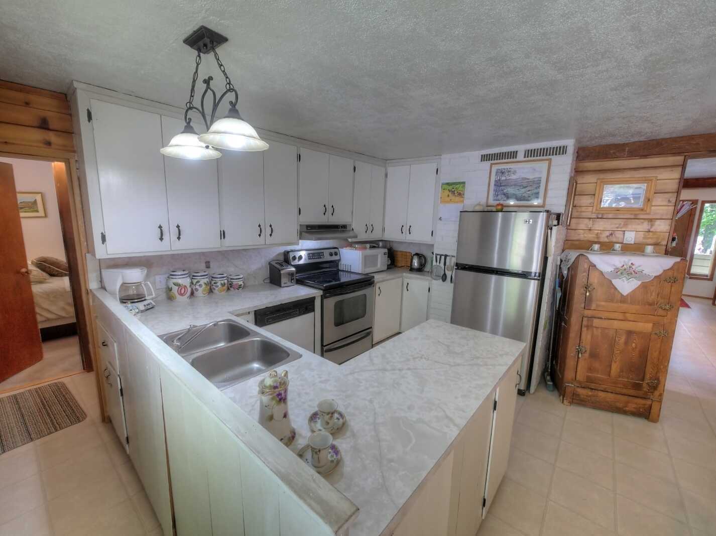 MOTIVATED SELLERS!!!  READY TO DOWNSIZE!!!  Own the whole block!! Private 1/4 acre lot with Valhalla Mountain views throughout!! 2 Bay detached carport with workshop with ample storage and detached greenhouse. 3
