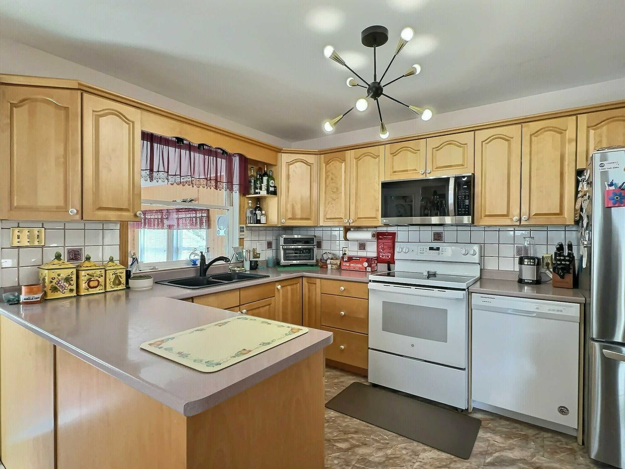 Welcome to this well-maintained 3-bedroom split entry home, ideally located in a highly sought-after Valley neighborhood! 5