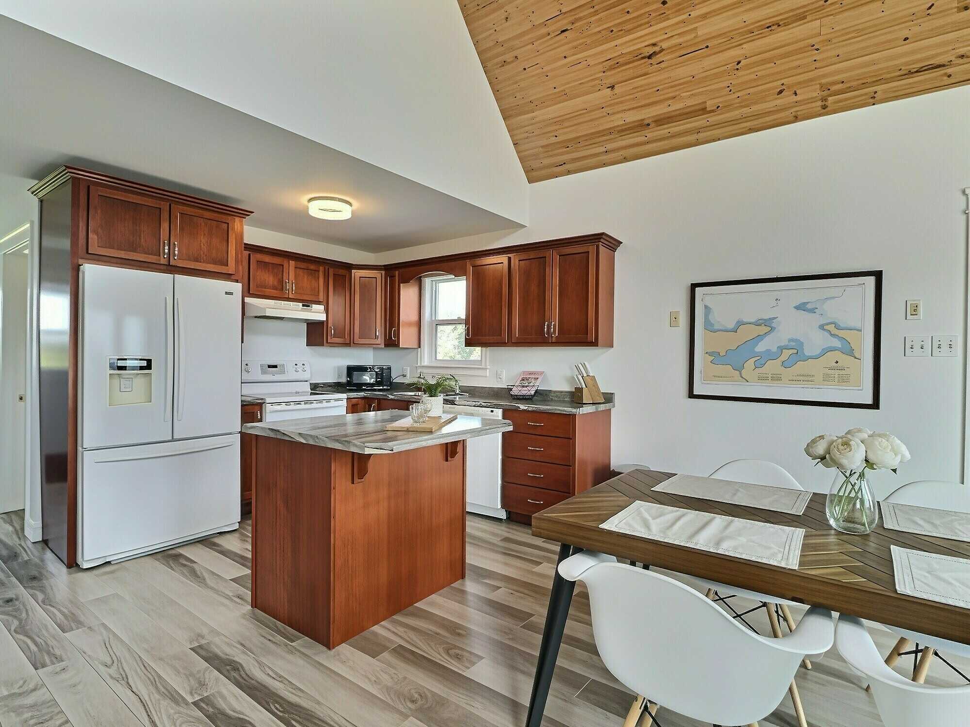 Experience coastal living at its finest with this exceptional executive waterfront estate set on approximately 4 private acres, complete with a secluded beach and breathtaking ocean views! 4